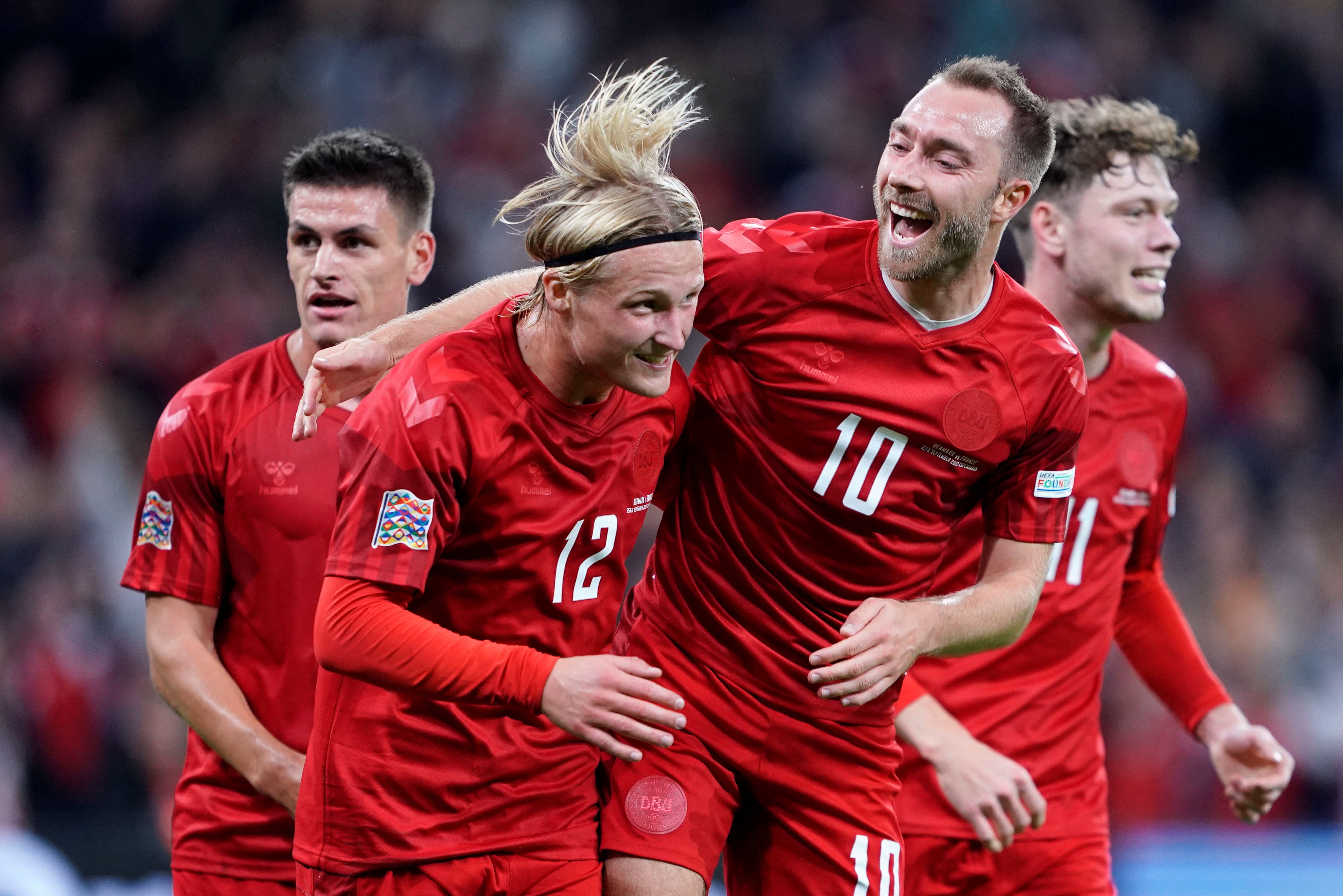 Denmark celebrate scoring vs France.