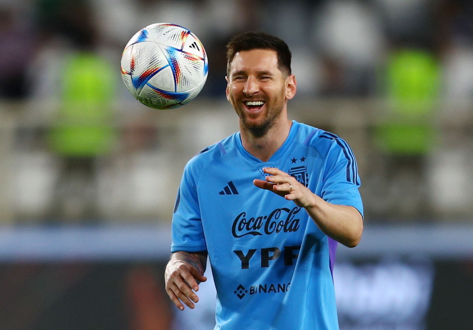 Lionel Messi laughs during Argentina training session