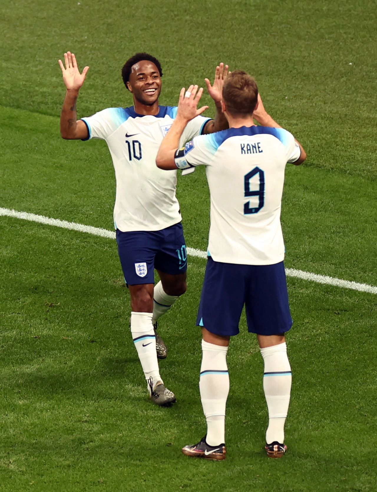 England's Sterling and Kane celebrate vs Iran.