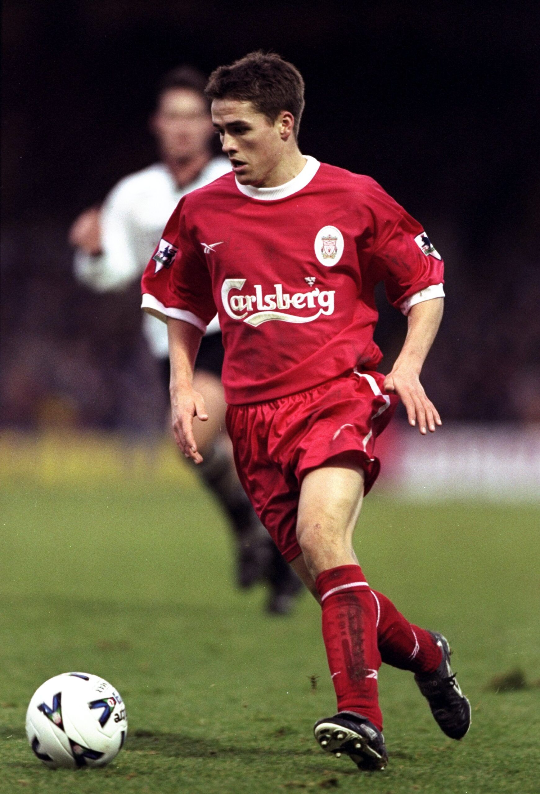 Owen playing in a 1990s Reebok Liverpool shirt.