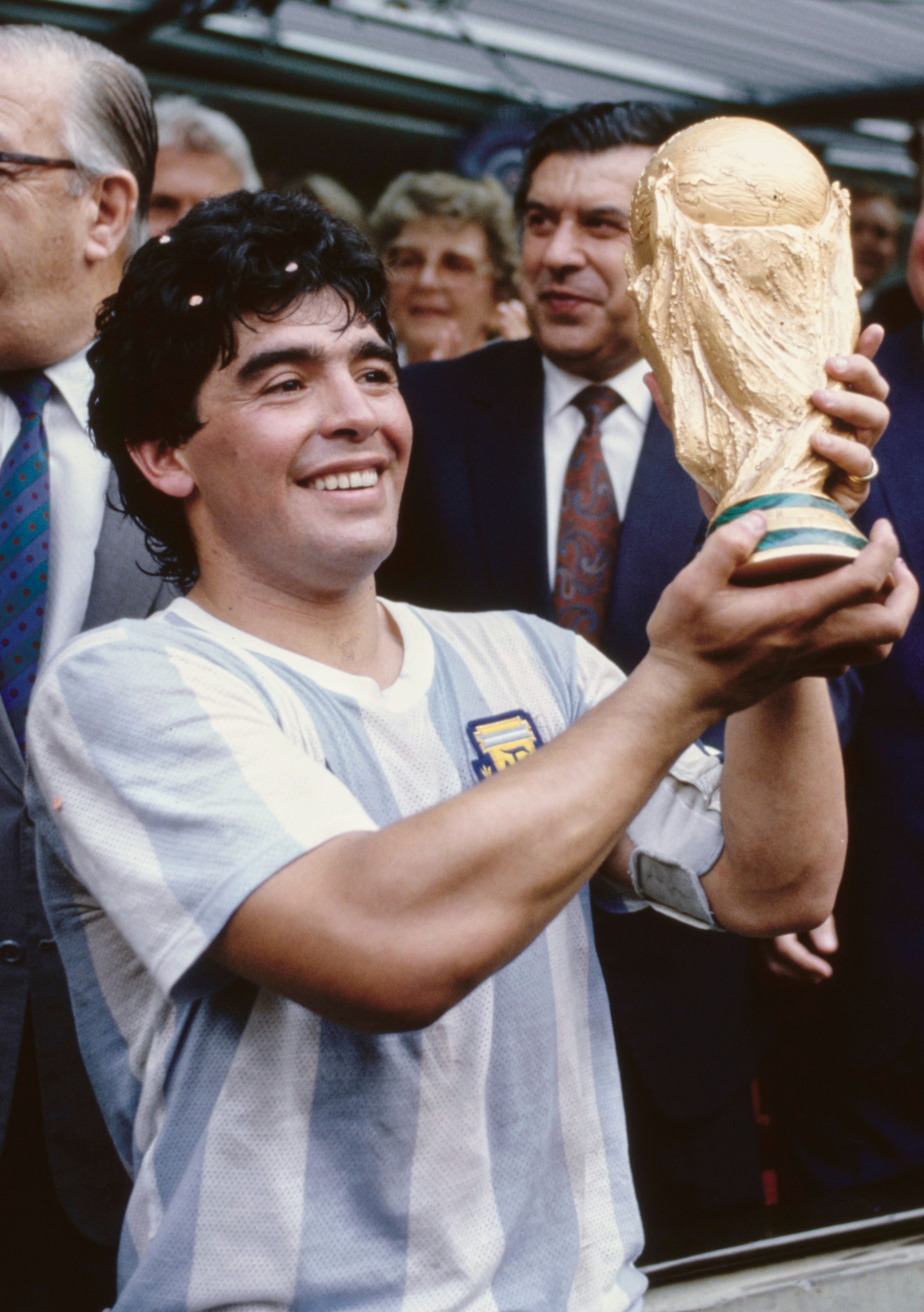 Diego Maradona holds the World Cup trophy aloft