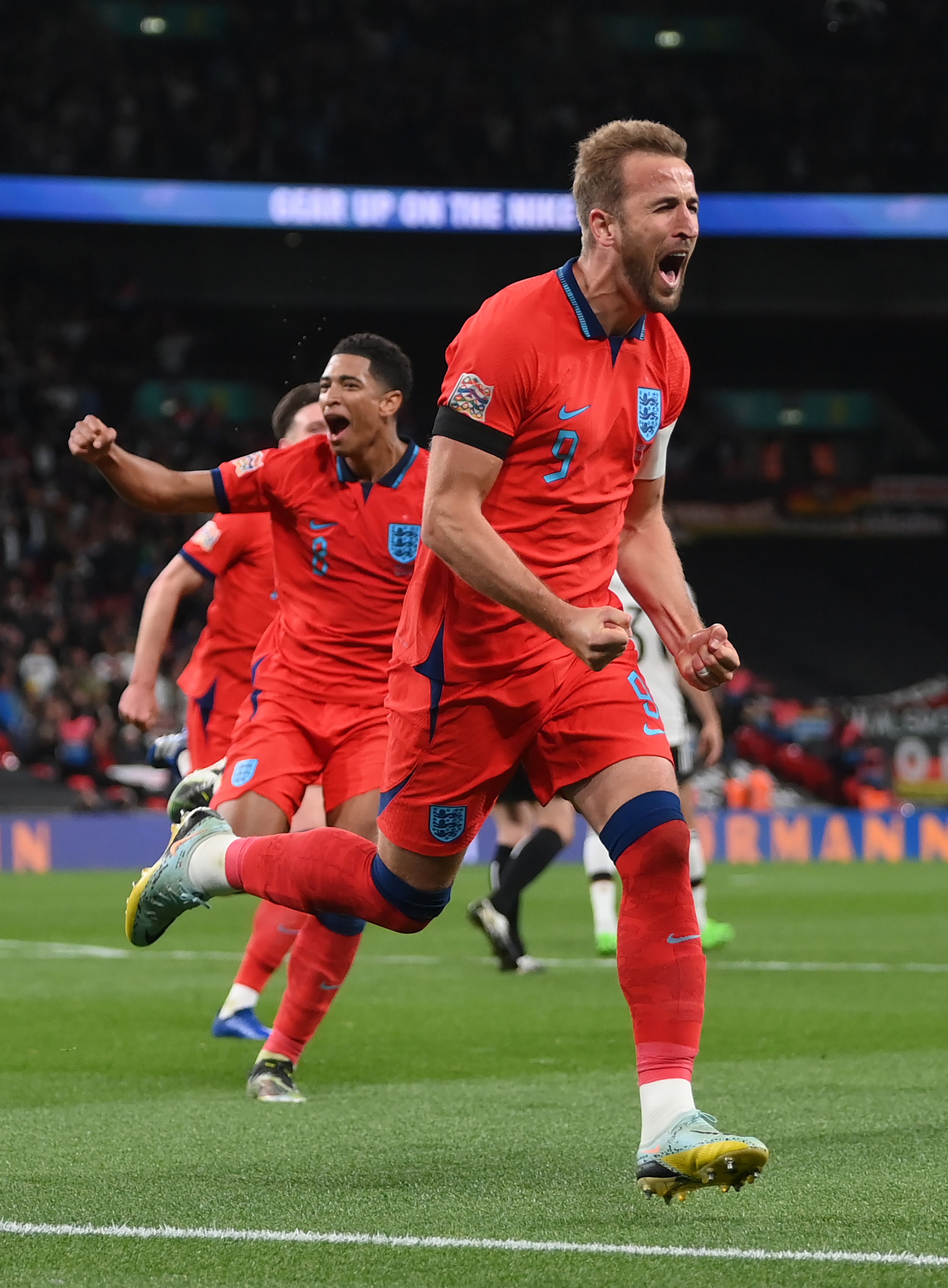 Kane celebrates scoring for England.