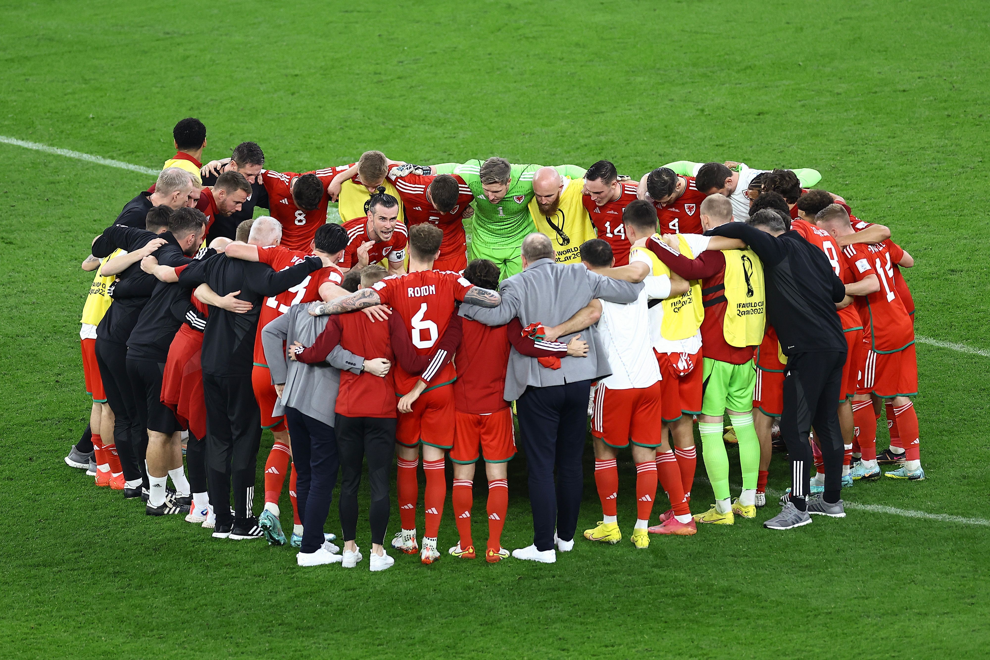 Wales huddles following the FIFA World Cup Qatar 2022 Group B match between USA and Wales at Ahmad Bin Ali Stadium on November 21, 2022 in Doha, Qatar.