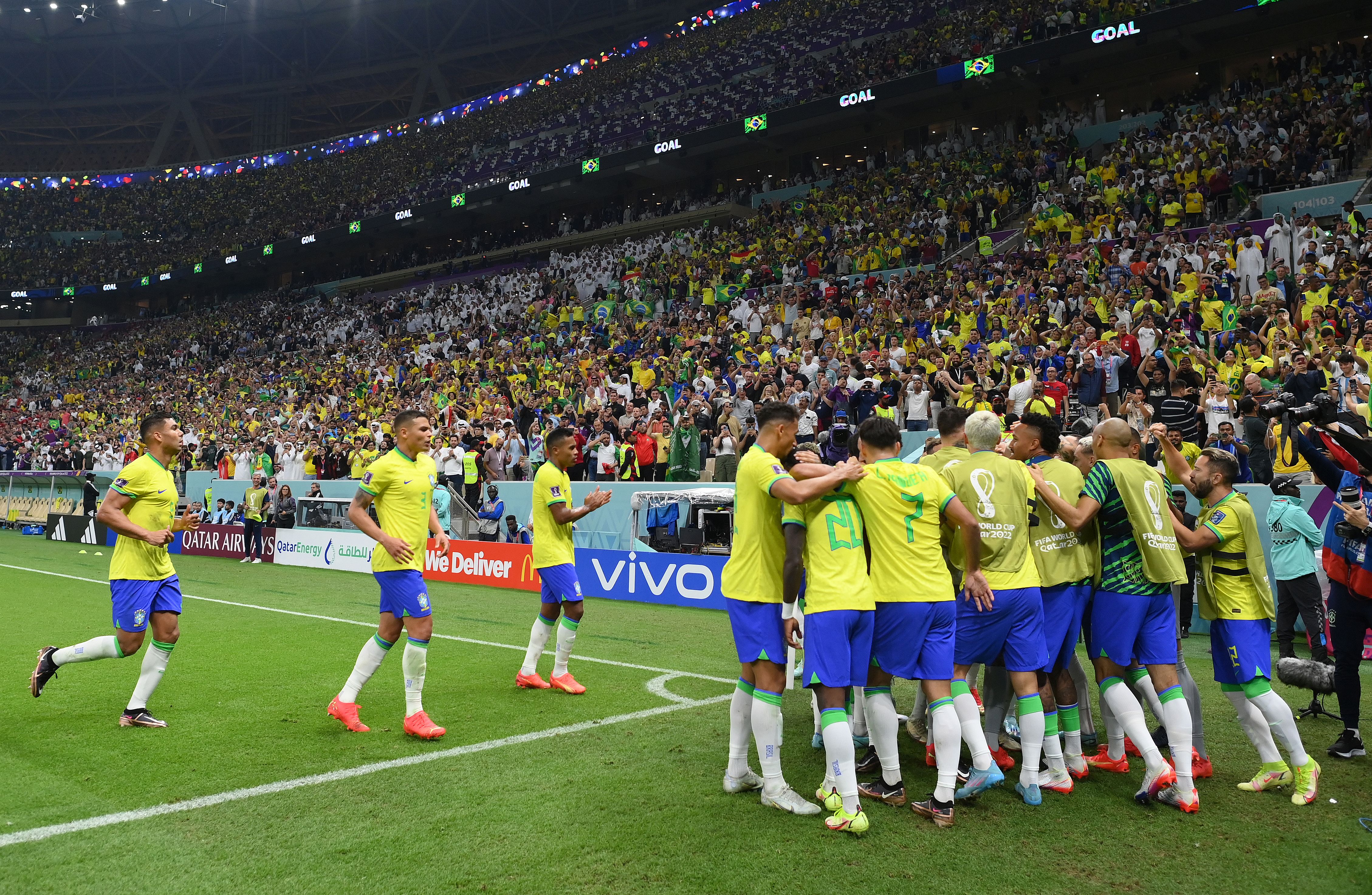 Brazil players celebrate Richarlison's goal vs Serbia