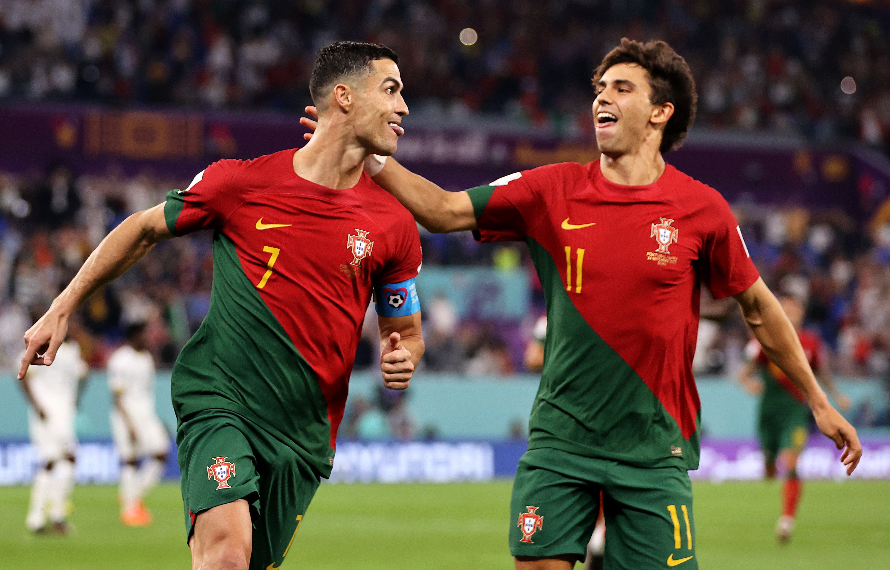 Cristiano Ronaldo of Portugal celebrates with Joao Felix after scoring 