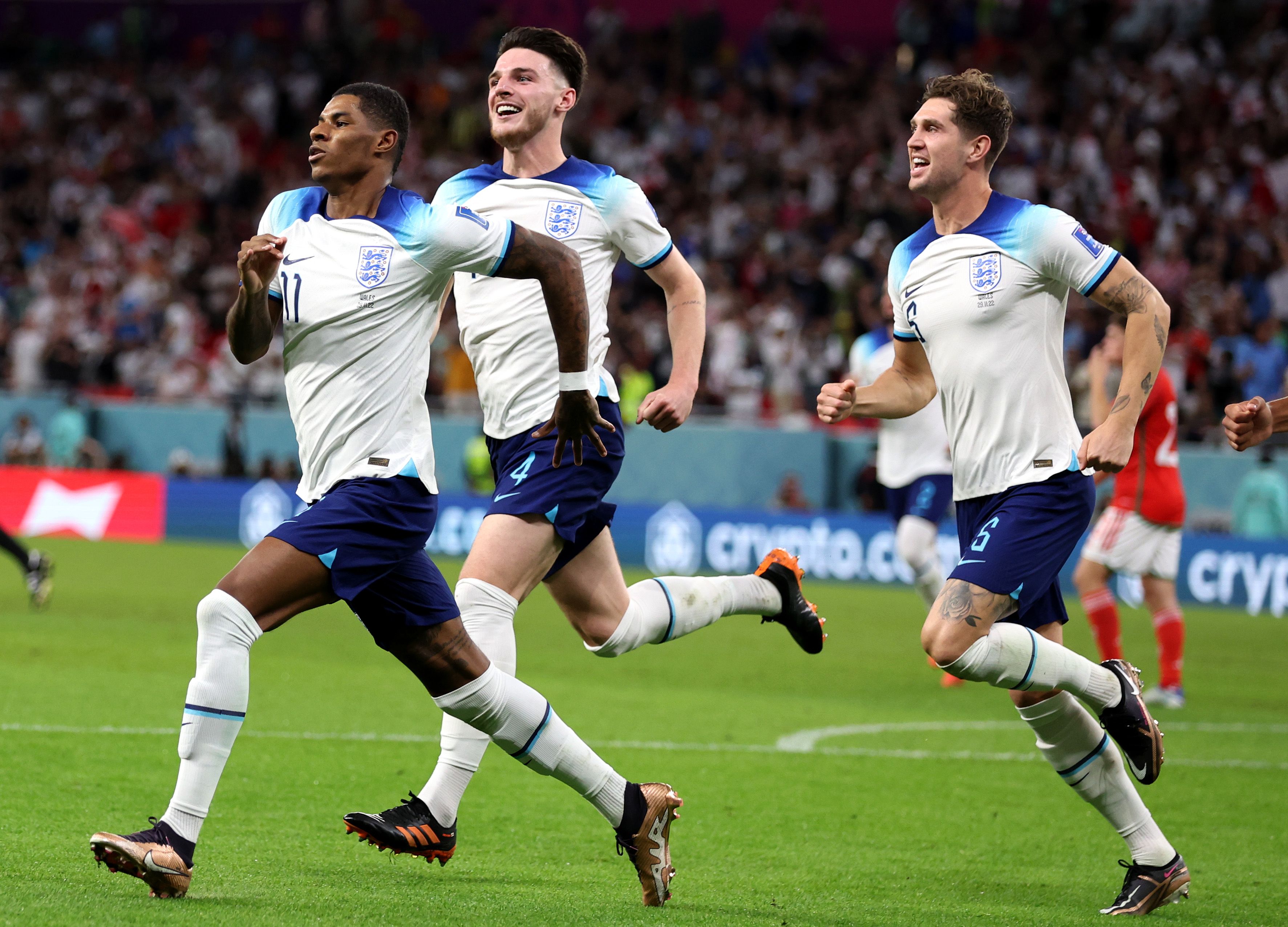 Marcus Rashford of England celebrates after scoring their team's first goal