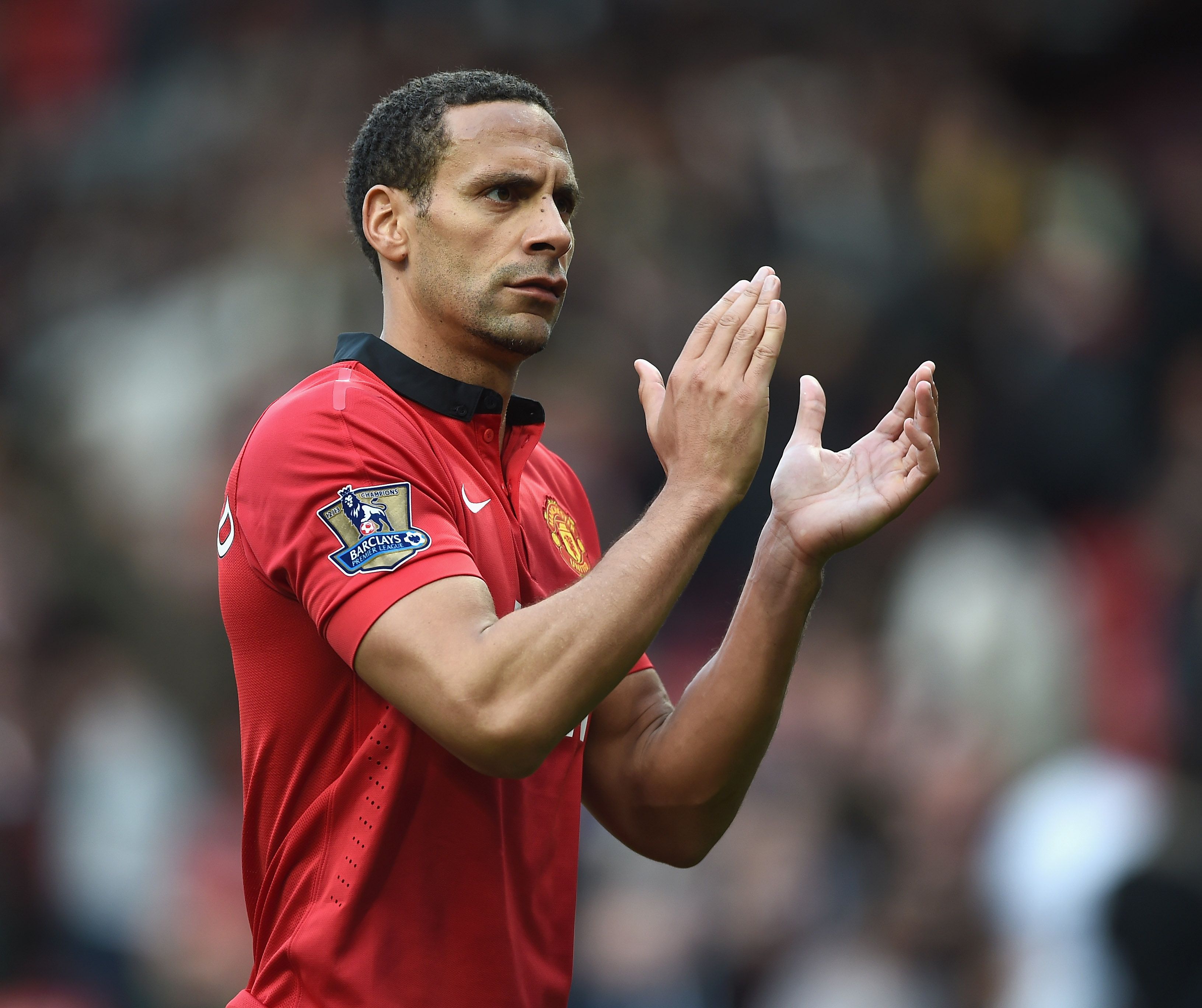 Rio Ferdinand of Manchester United applauds the fans after the Barclays Premier League match between Manchester United and Norwich City at Old Trafford on April 26, 2014 in Manchester, England.