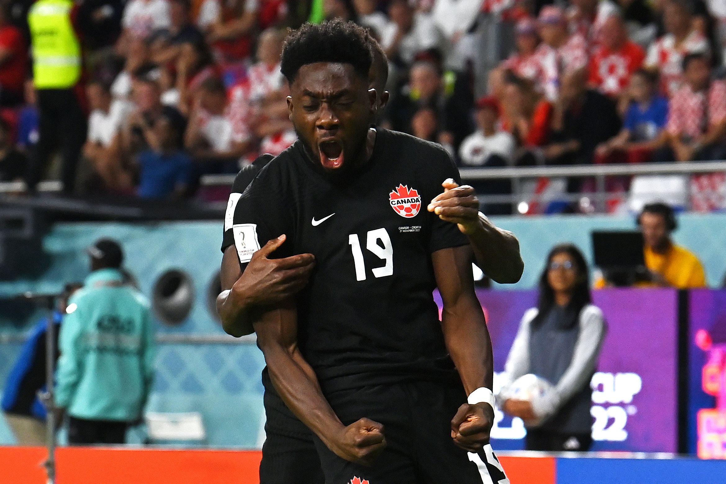 Alphonso Davies celebrates scoring for Canada at the World Cup