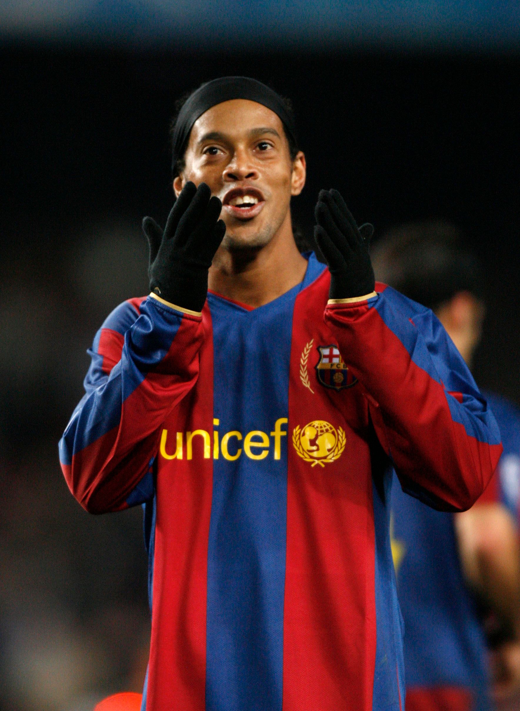 Ronaldinho celebrates for Barcelona.