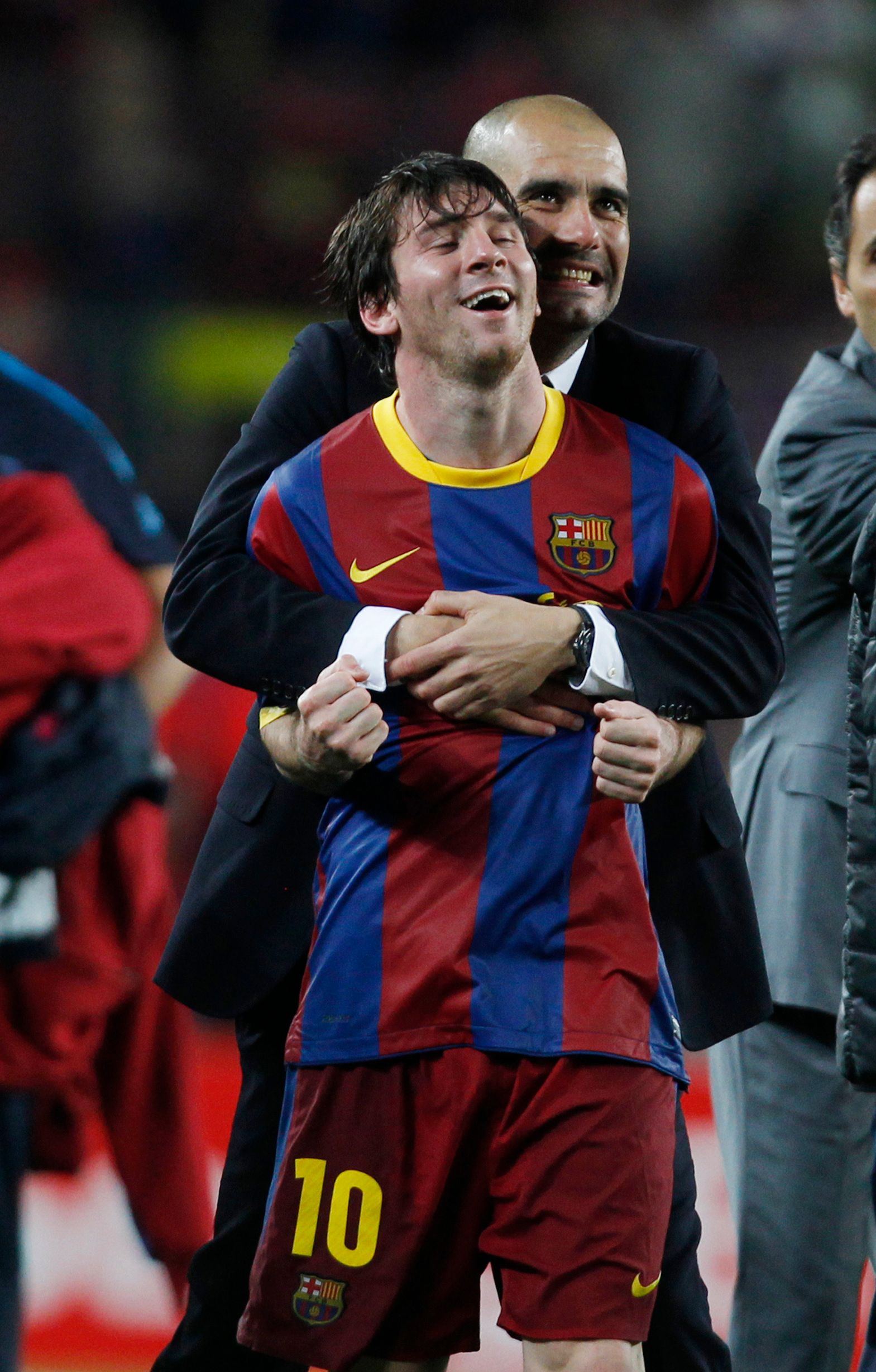 Guardiola and Messi embrace at Barcelona.