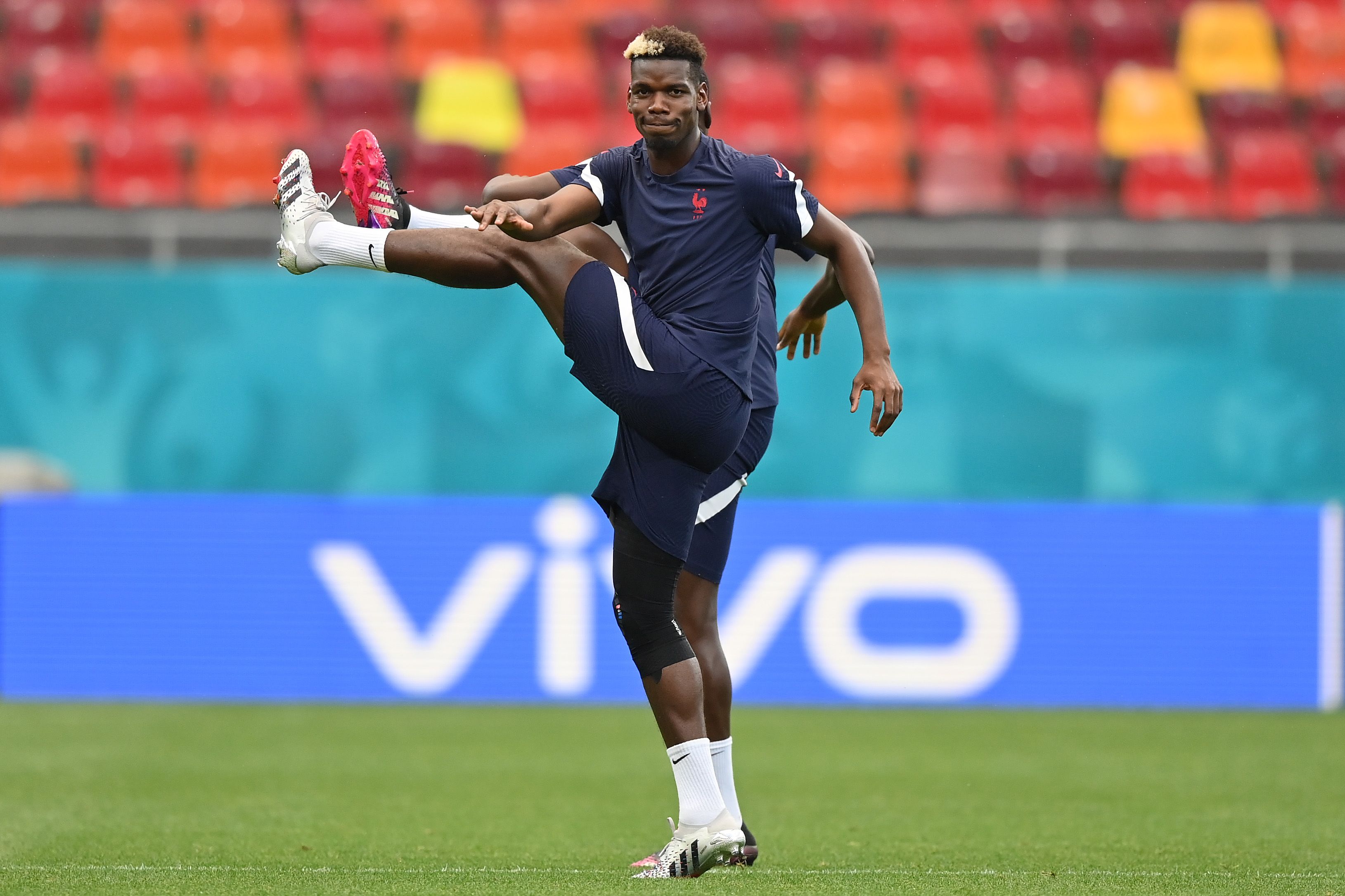 Paul Pogba of France stretches during the France Training Session ahead of the UEFA Euro 2020 Round of 16 match between France and Switzerland at National Arena on June 27, 2021 in Bucharest, Romania