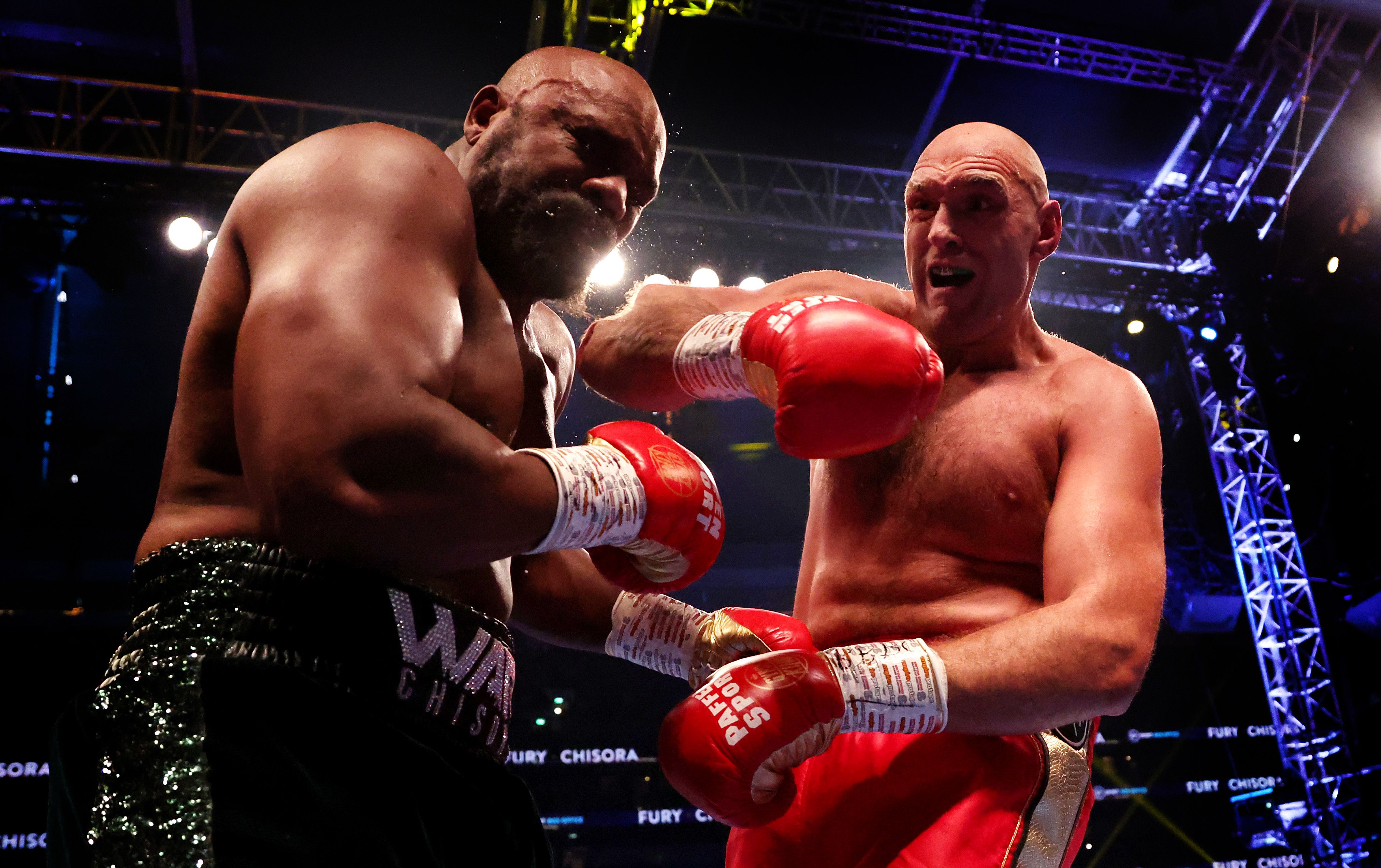 Tyson Fury lands a blow on Derek Chisora