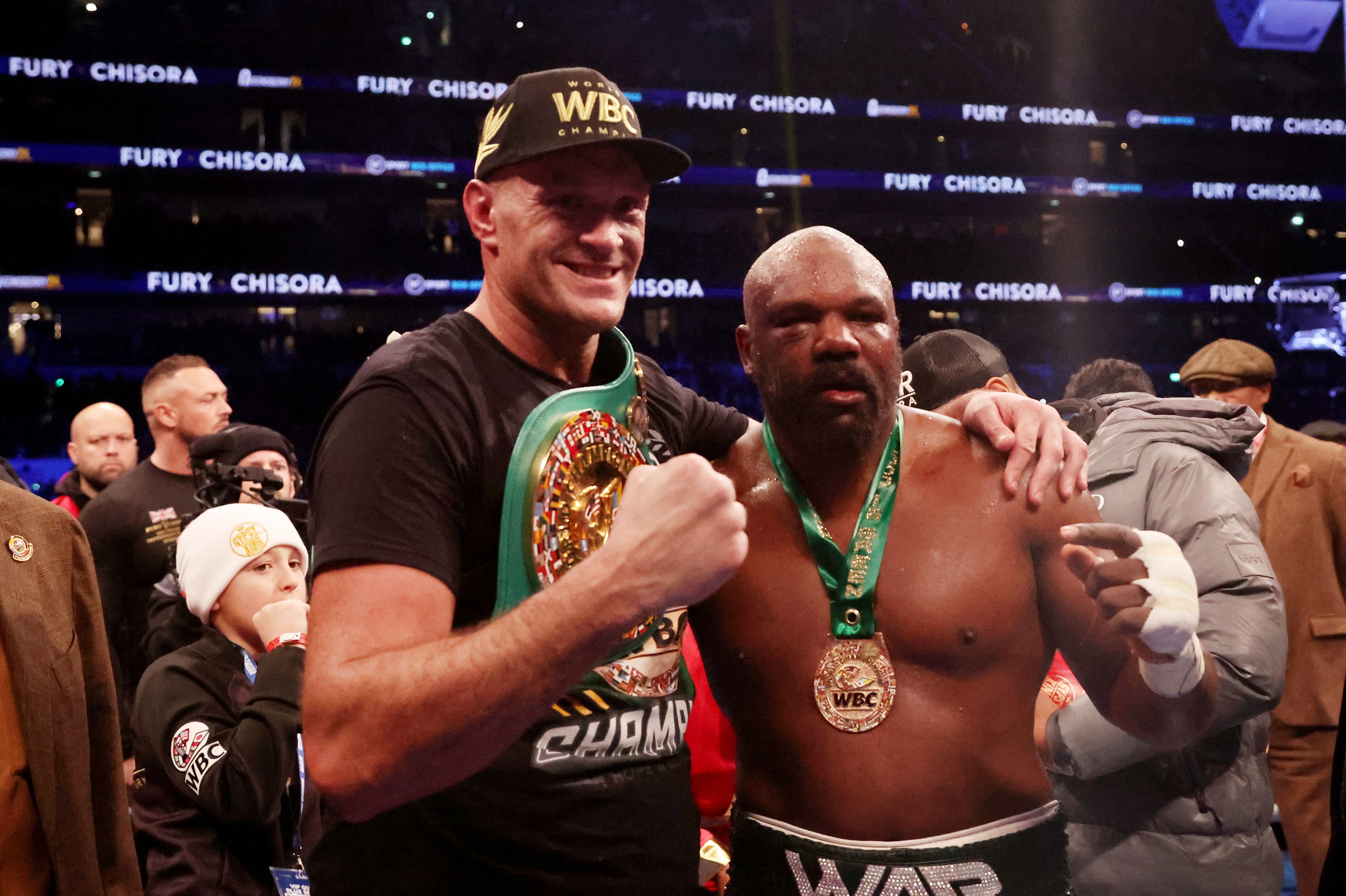 Tyson Fury and Derek Chisora pose for photos after their fight