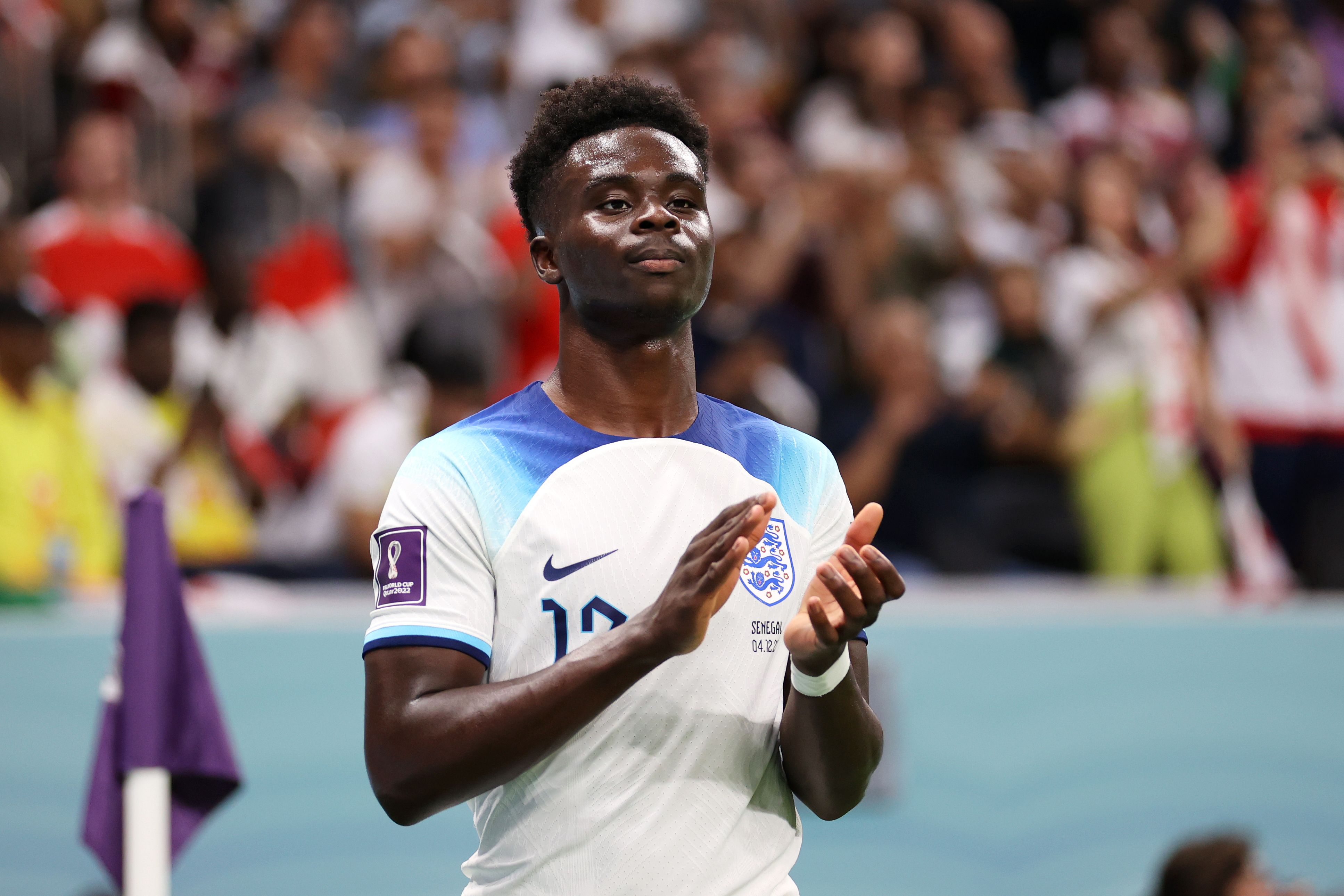 Bukayo Saka applauds the England fans