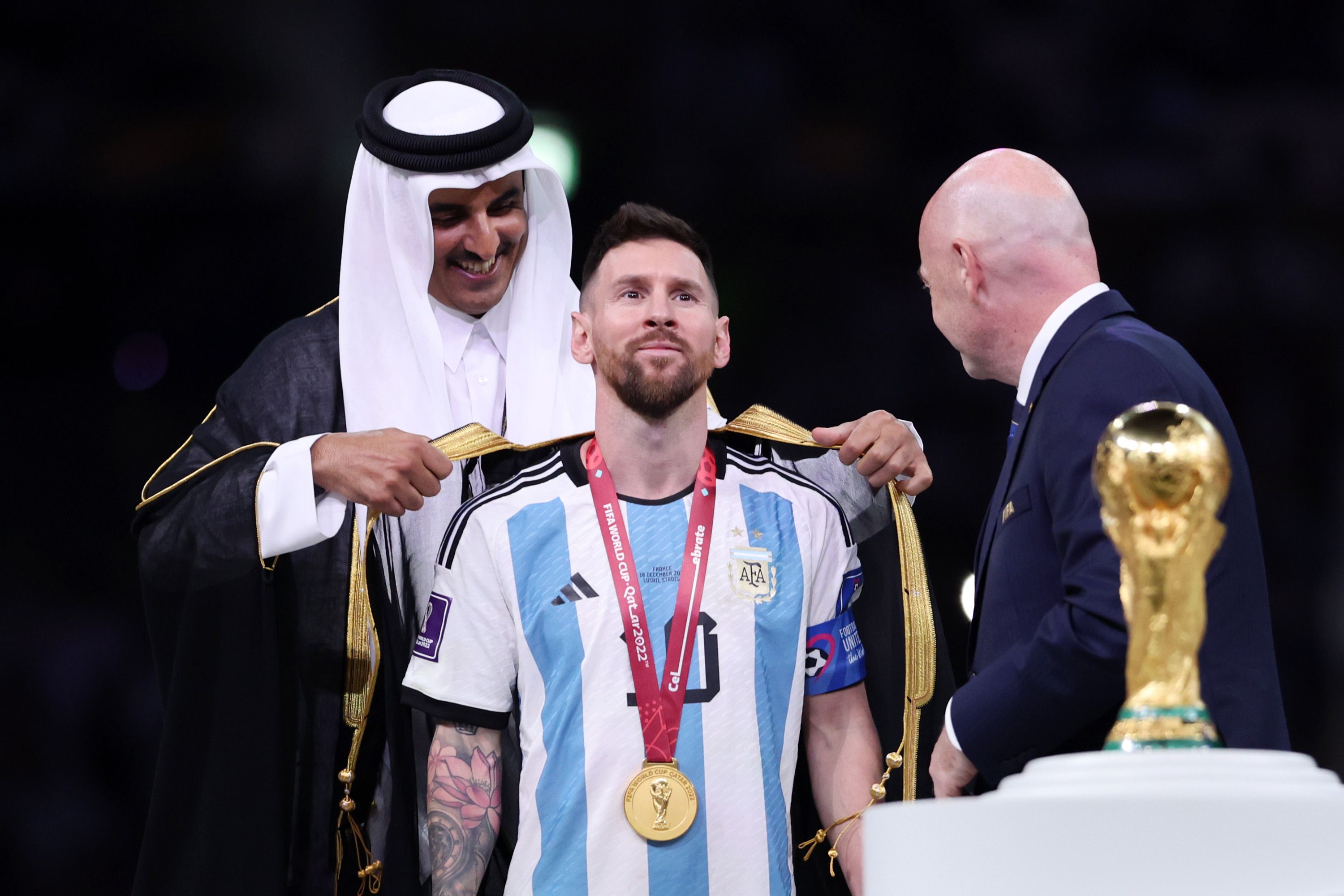 Lionel Messi is presented with a bisht