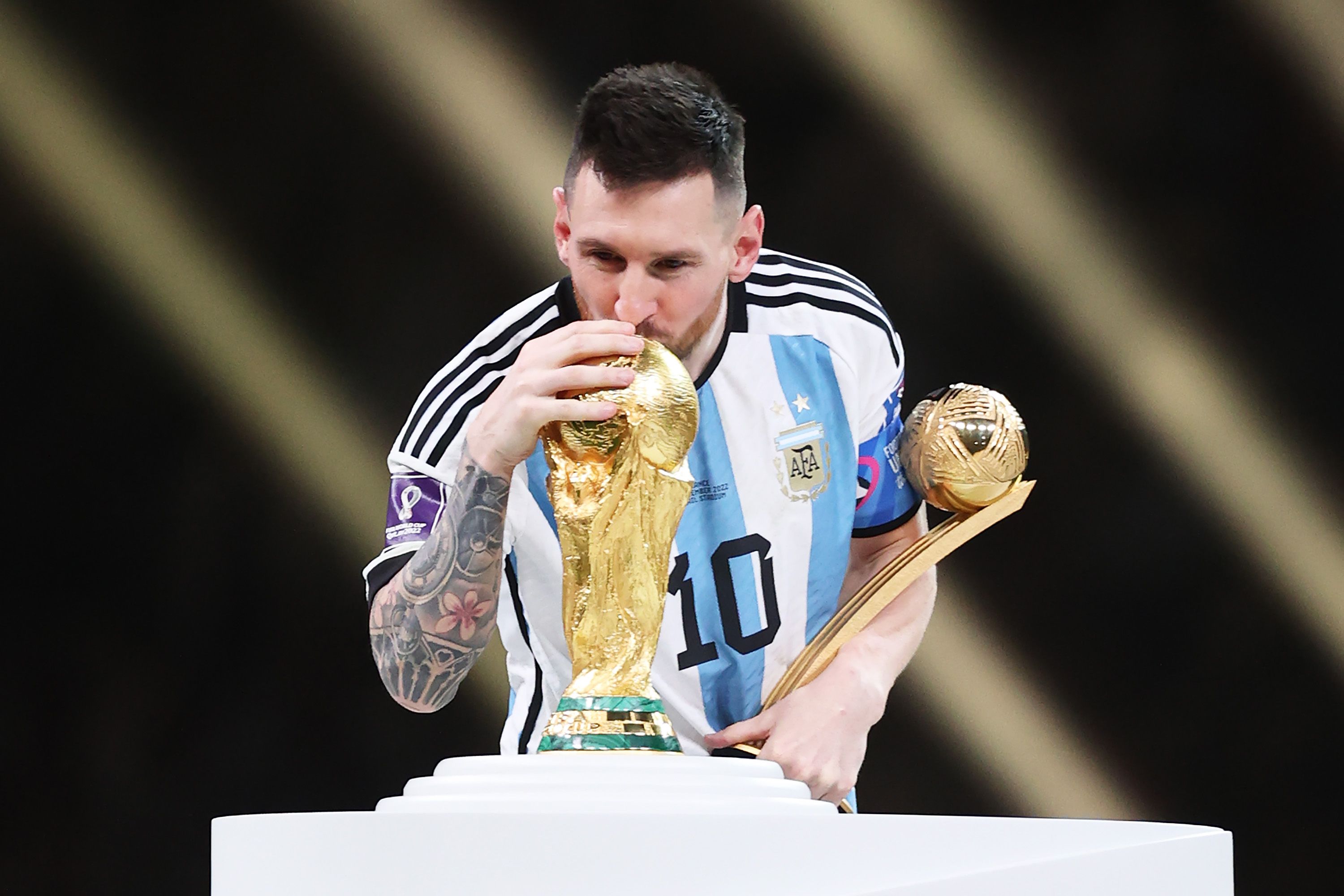 Lionel Messi with the World Cup trophy