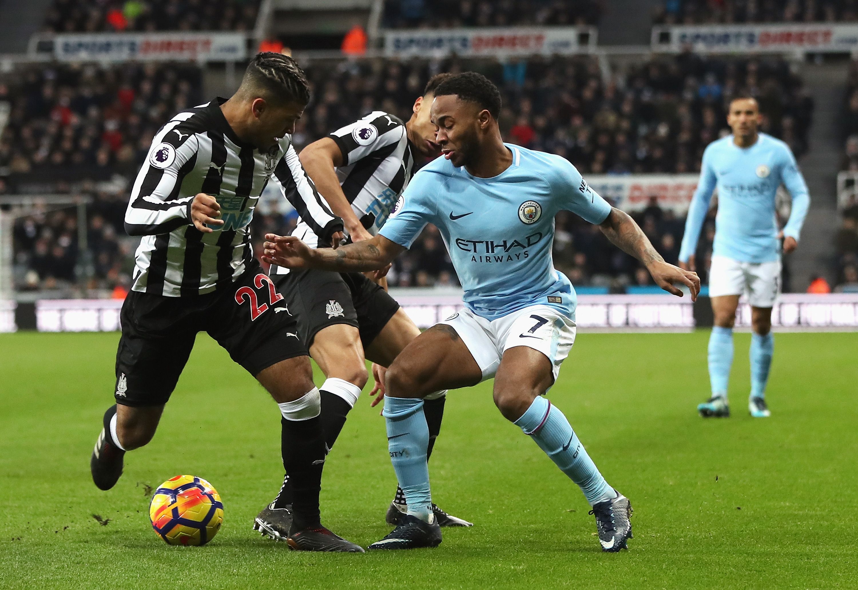 Raheem Sterling of Manchester City takes on DeAndre Yedlin of Newcastle United