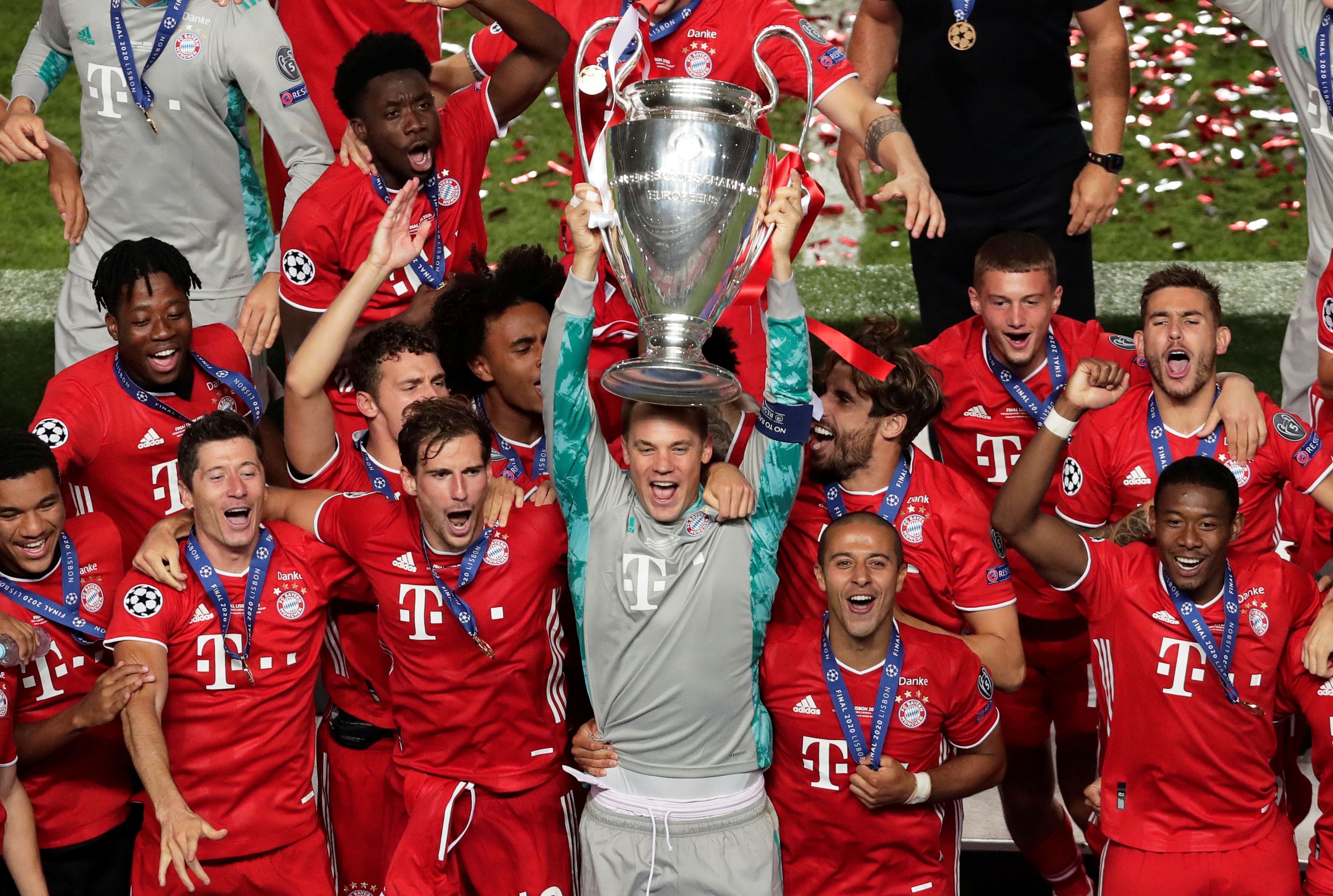 Bayern's Neuer lifts the Champions League trophy.