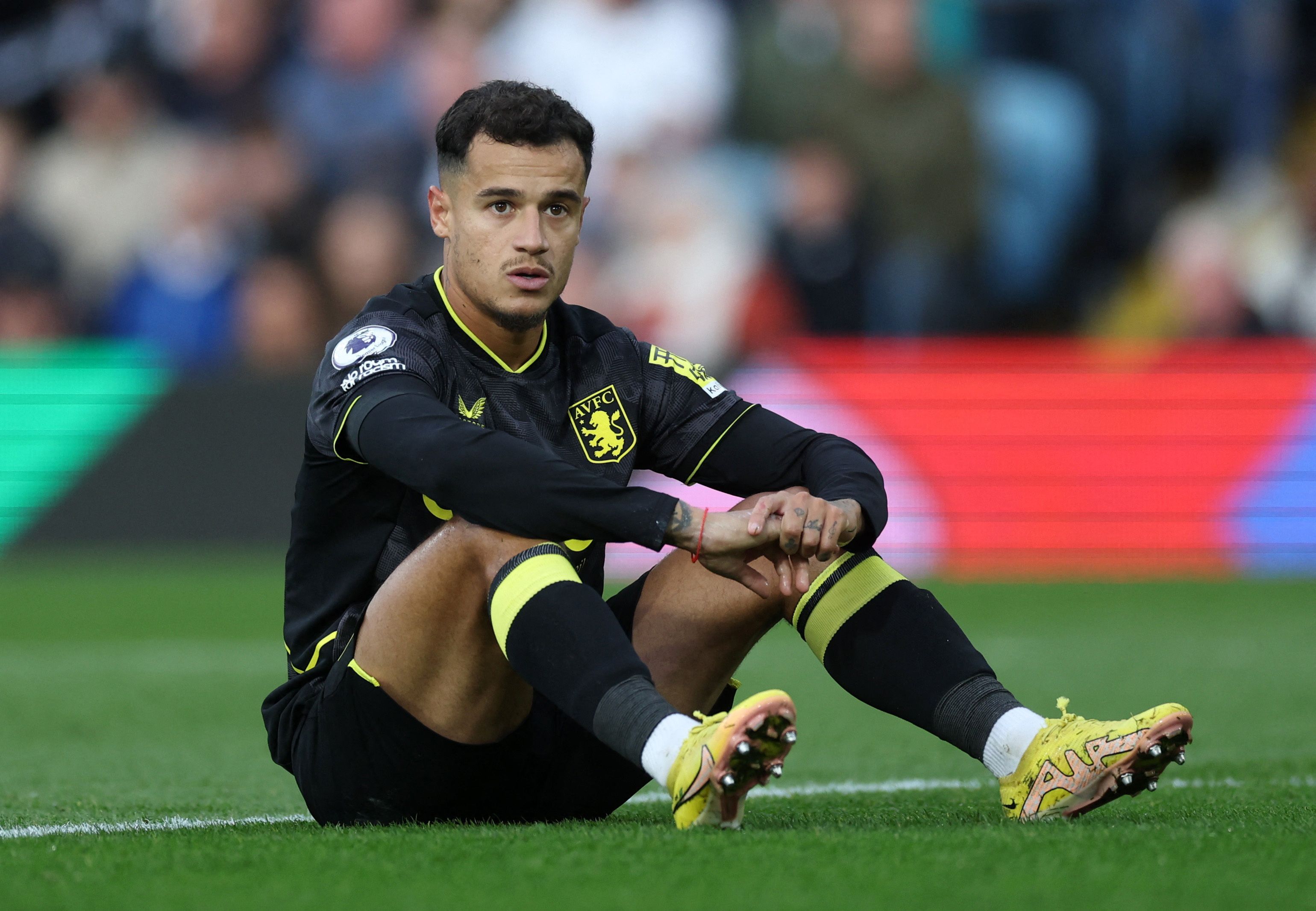 Coutinho sits down during a Villa game.