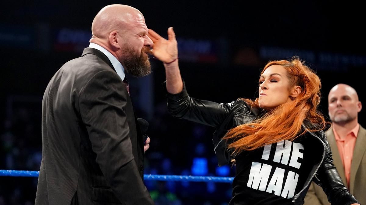Becky Lynch slapping Triple H