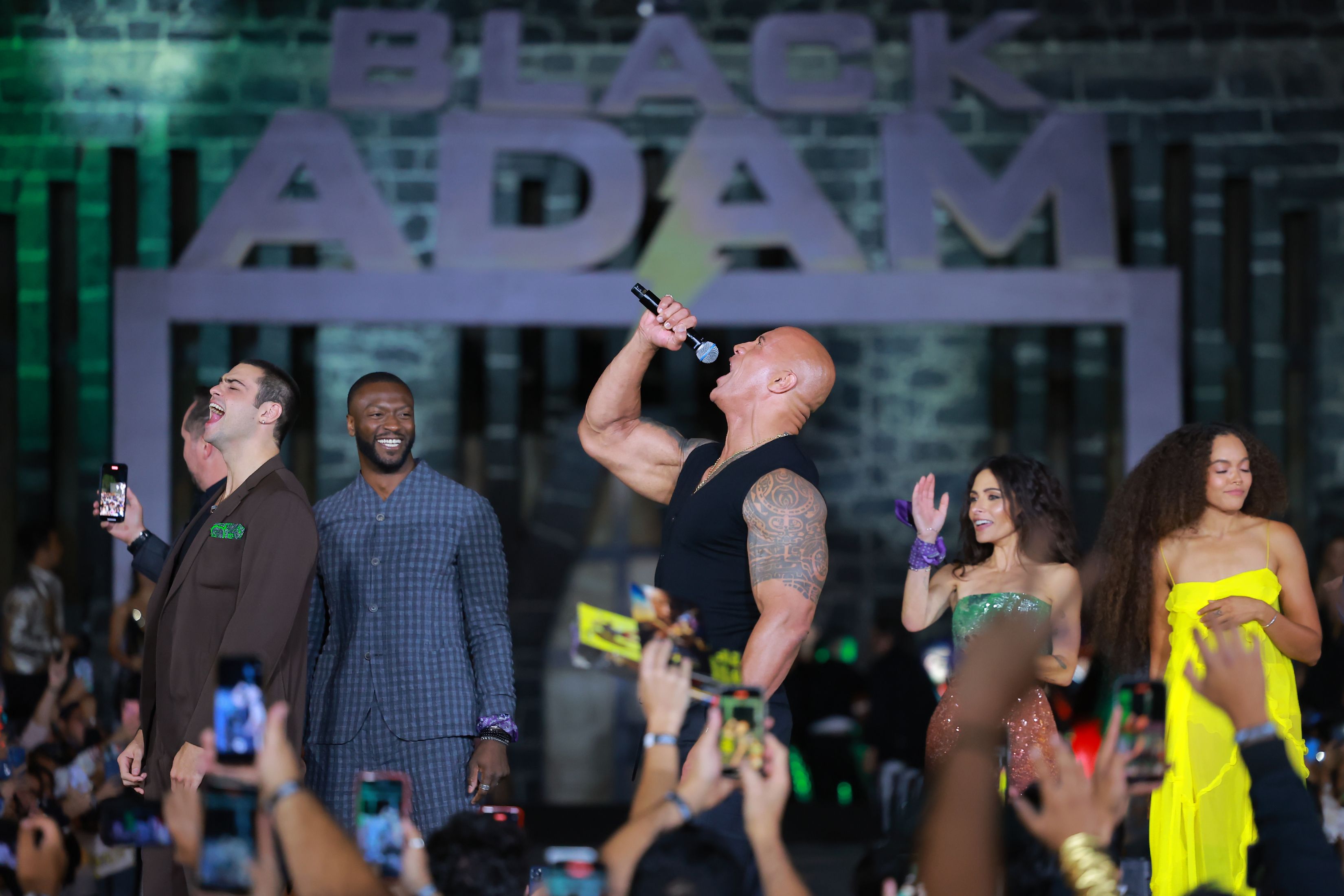 Dwayne Johnson talks during the black carpet for the Black Adam Fan Event