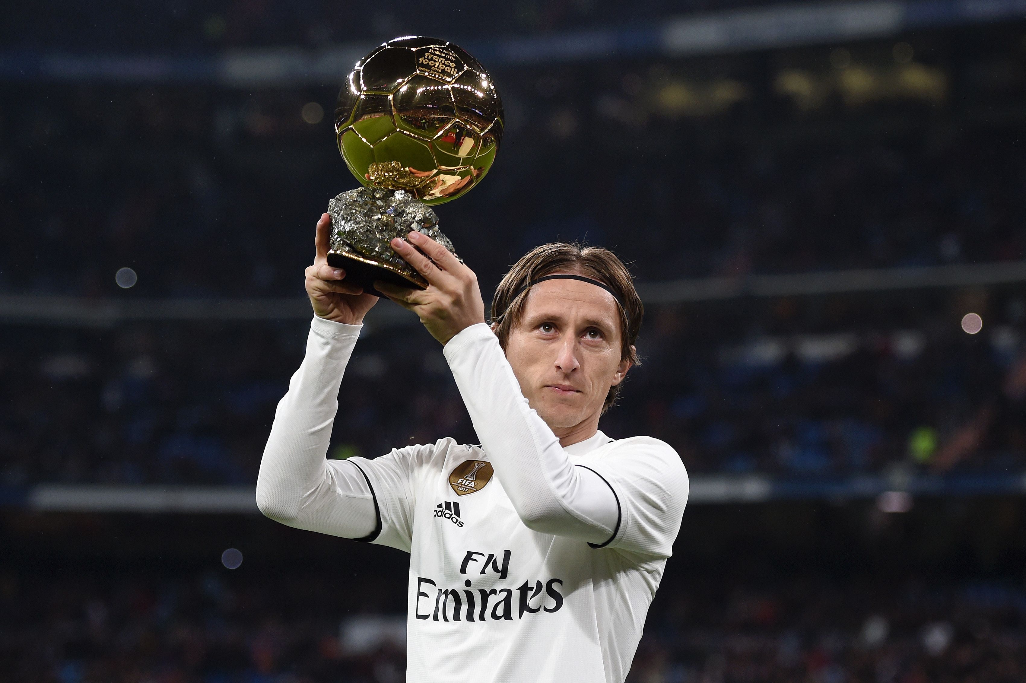 Luka Modric of Real Madrid presents his Ballon d'Or Trophy to the crowd