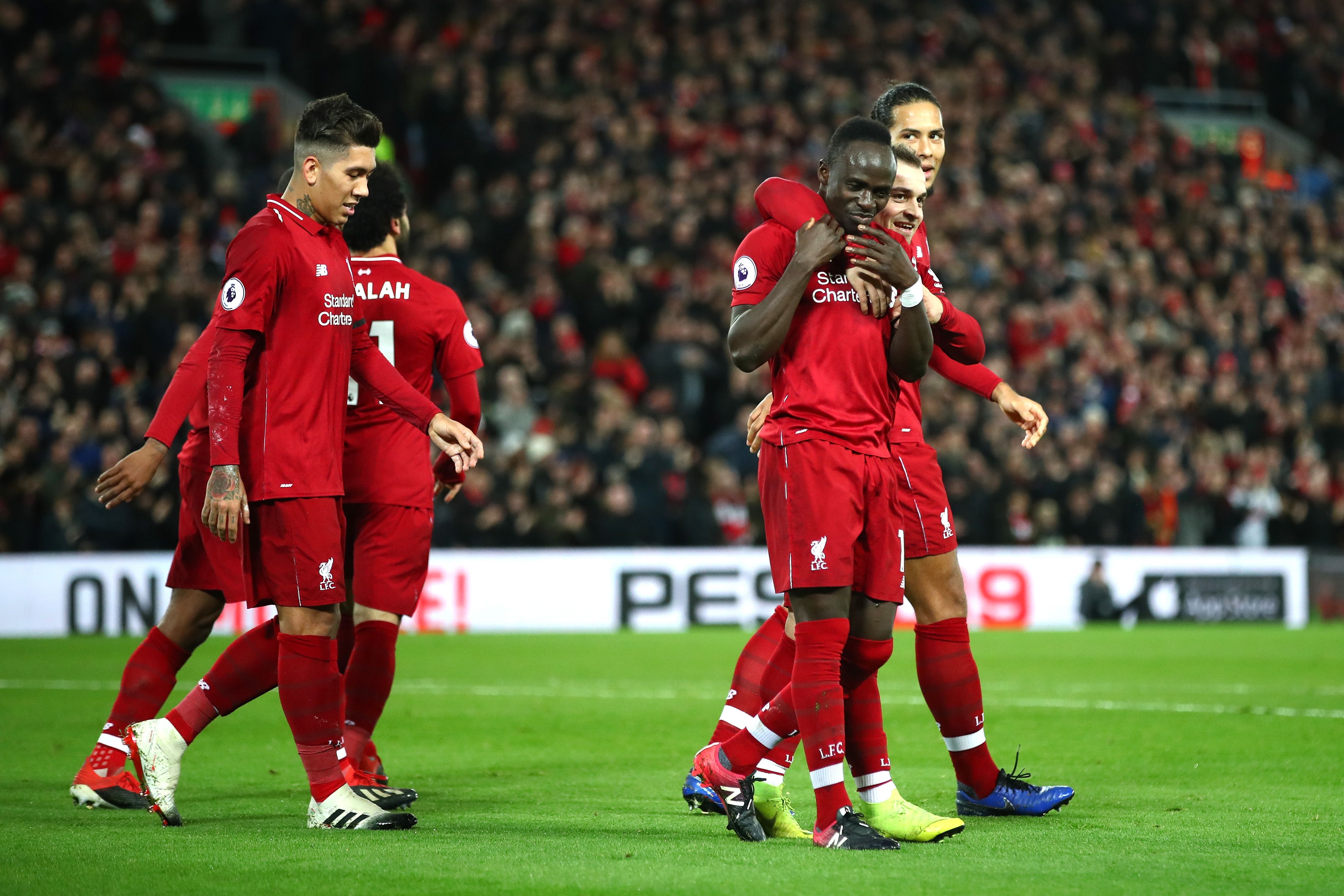 LIVERPOOL, ENGLAND - DECEMBER 29: Sadio Mane of Liverpool celebrates with team mates after scoring his sides third goal during the Premier League match between Liverpool FC and Arsenal FC at Anfield on December 29, 2018 in Liverpool, United Kingdom. (Photo by Clive Brunskill/Getty Images)