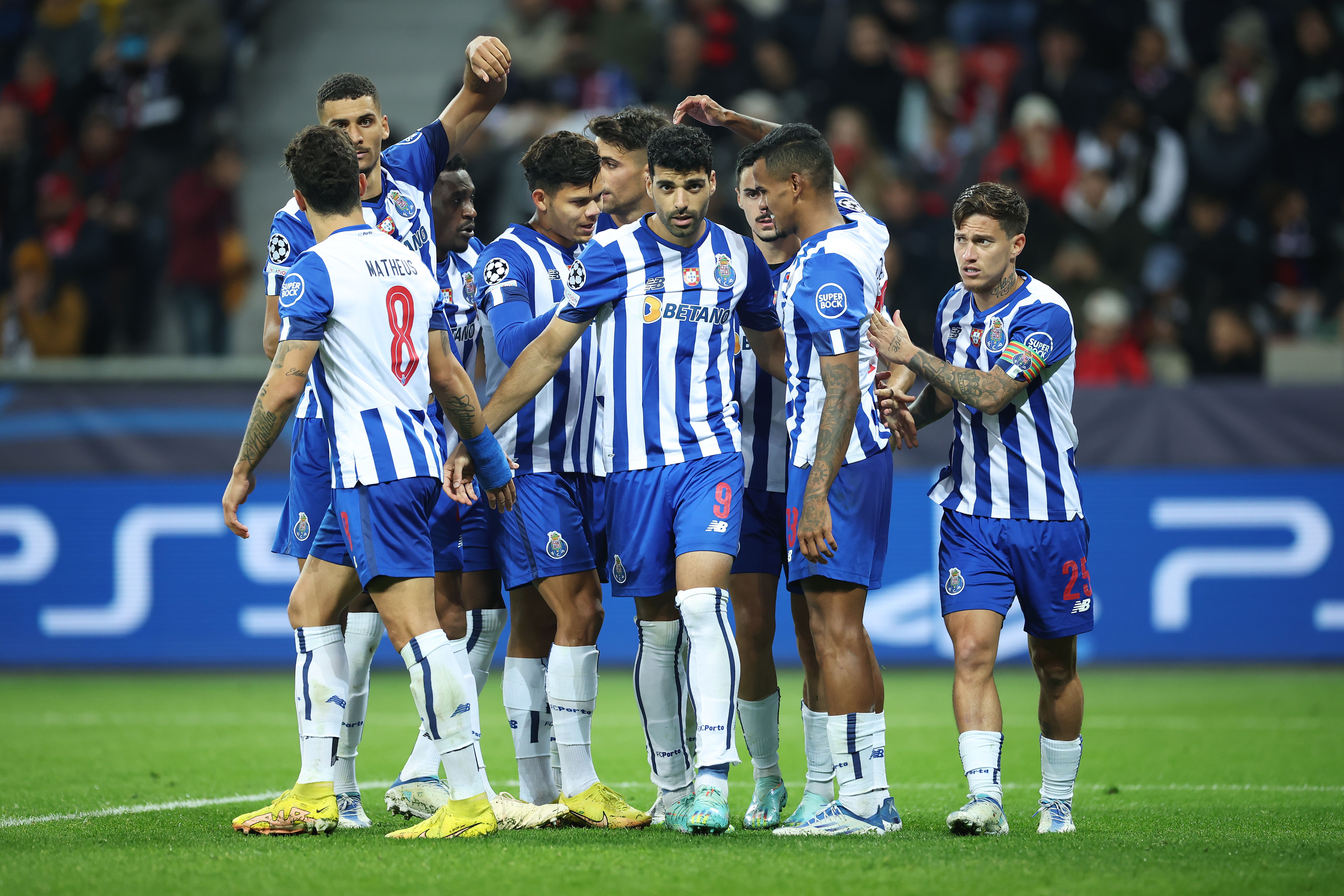 Porto celebrate scoring in the Champions League.