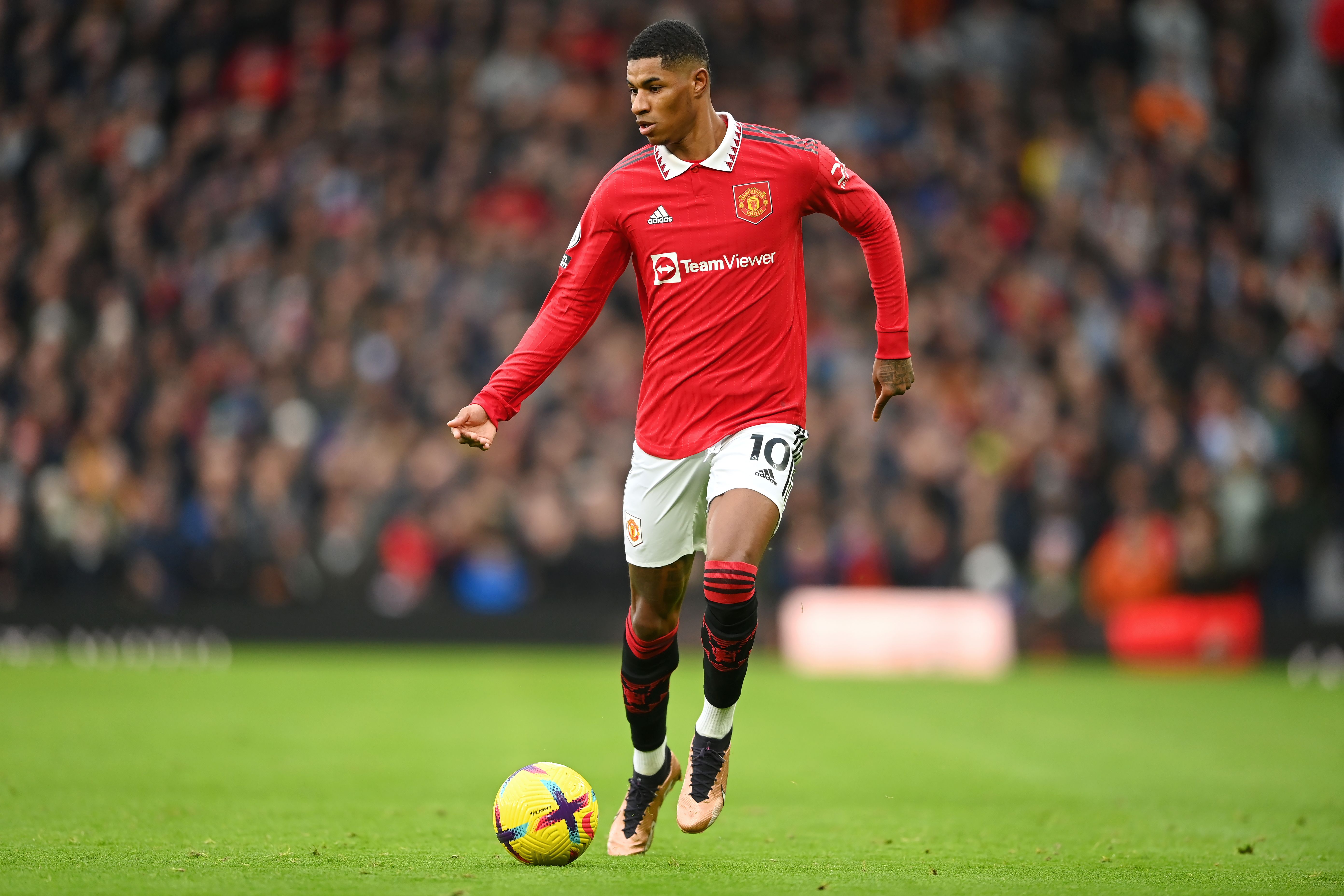  Marcus Rashford of Manchester United in action during the Premier League match between Manchester United and Manchester City at Old Trafford on January 14, 2023 in Manchester, England.