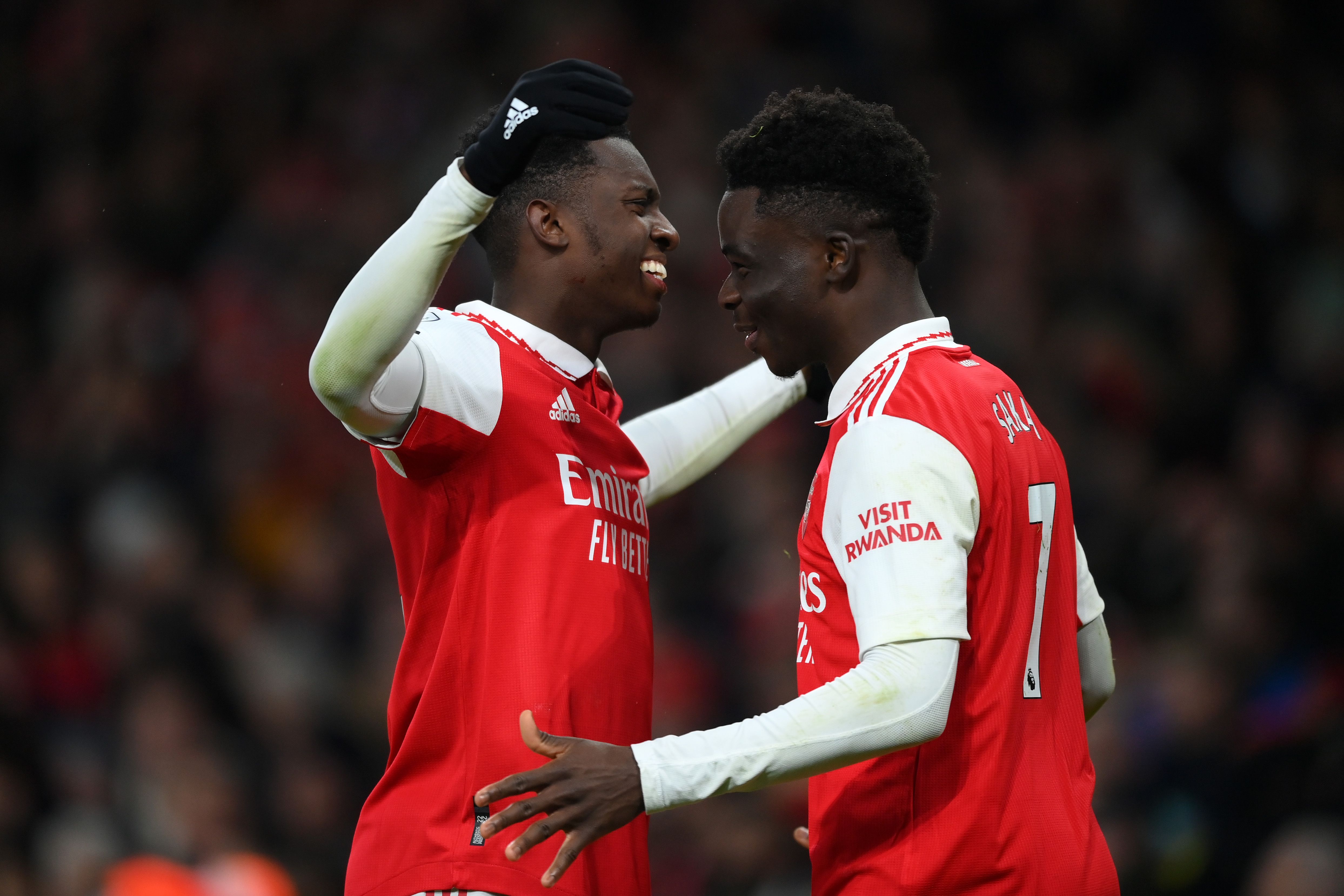 LONDON, ENGLAND - JANUARY 22: Eddie Nketiah celebrates with Bukayo Saka of Arsenal after scoring the team's third goal during the Premier League match between Arsenal FC and Manchester United at Emirates Stadium on January 22, 2023 in London, England. (Photo by Shaun Botterill/Getty Images)