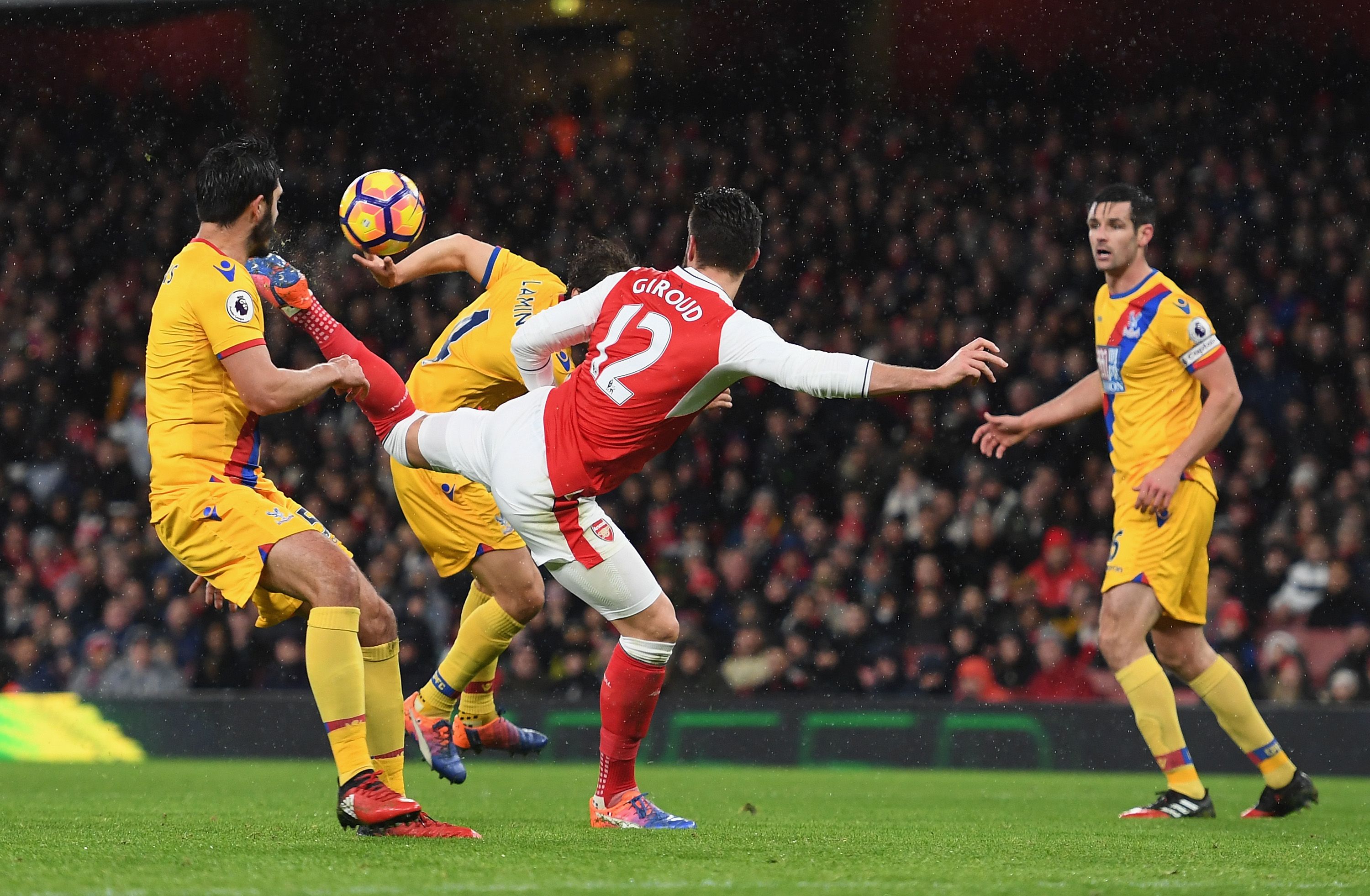 Olivier Giroud of Arsenal scores the opening goal during the Premier League match