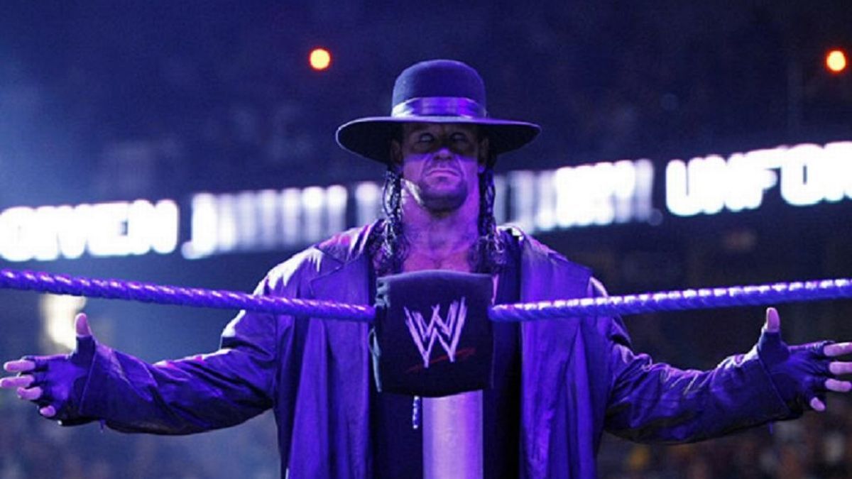 The Undertaker doing his iconic taunt