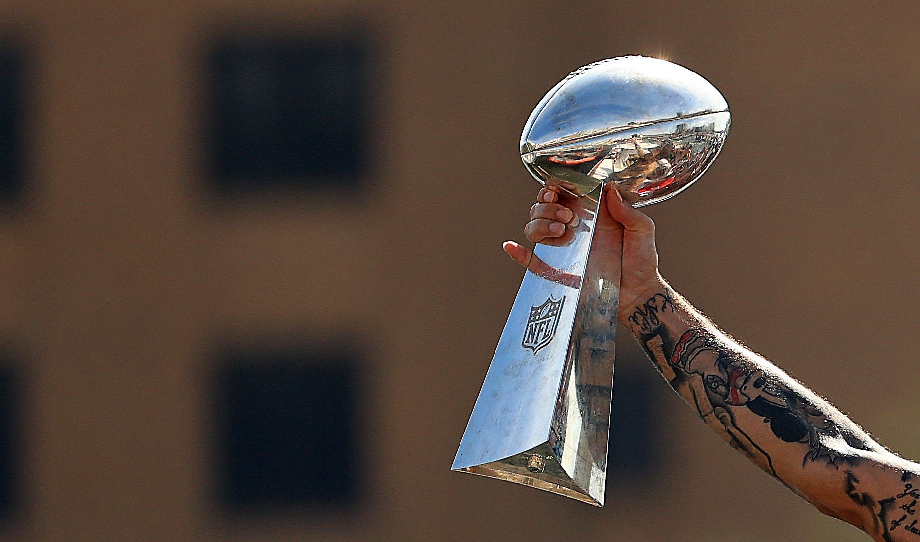 Mike Evans #13 of the Tampa Bay Buccaneers celebrates their Super Bowl LV victory with the Vince Lombardi trophy during a boat parade through the city on February 10, 2021 in Tampa, Florida.