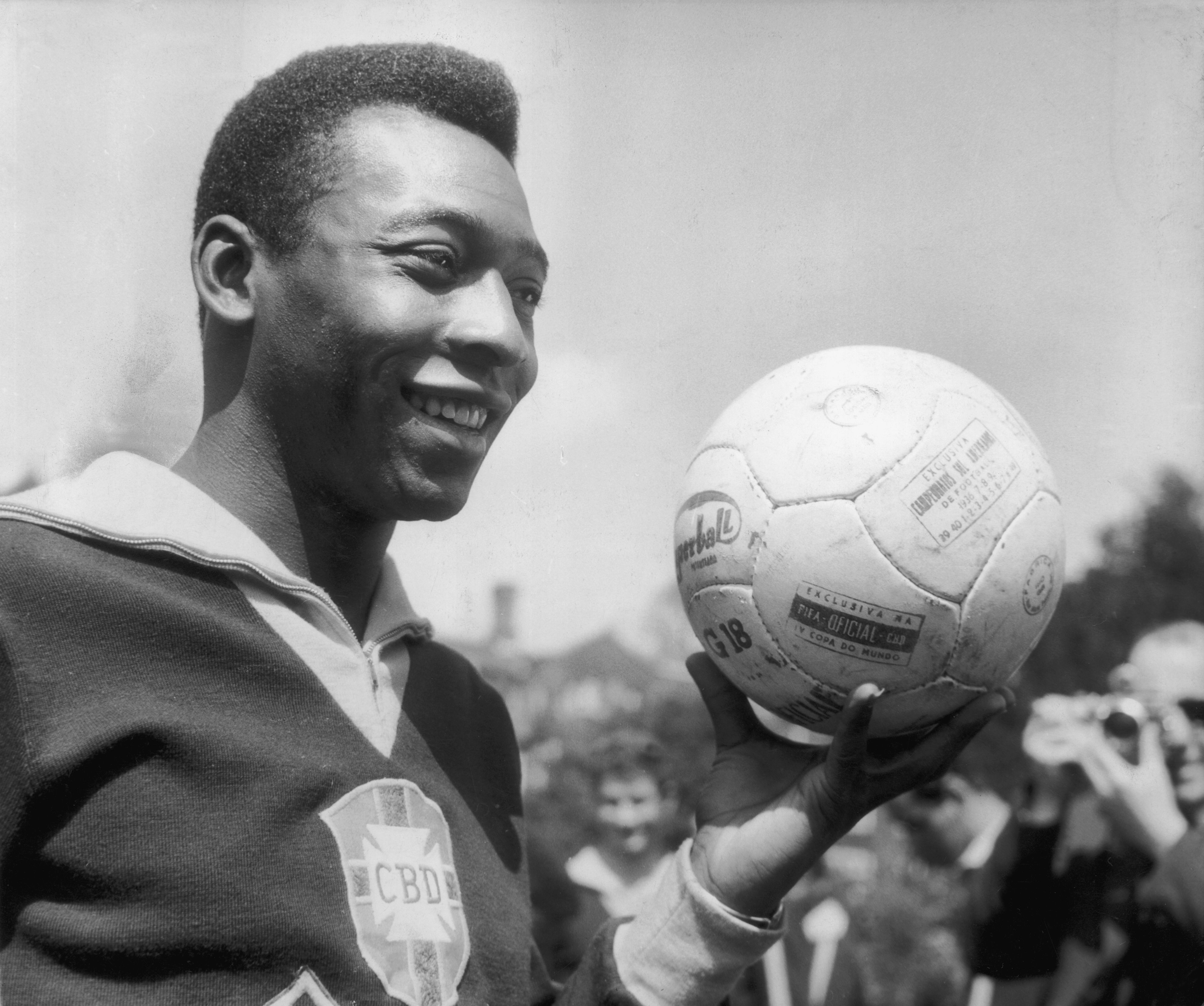 Brazil legend Pele holding a football