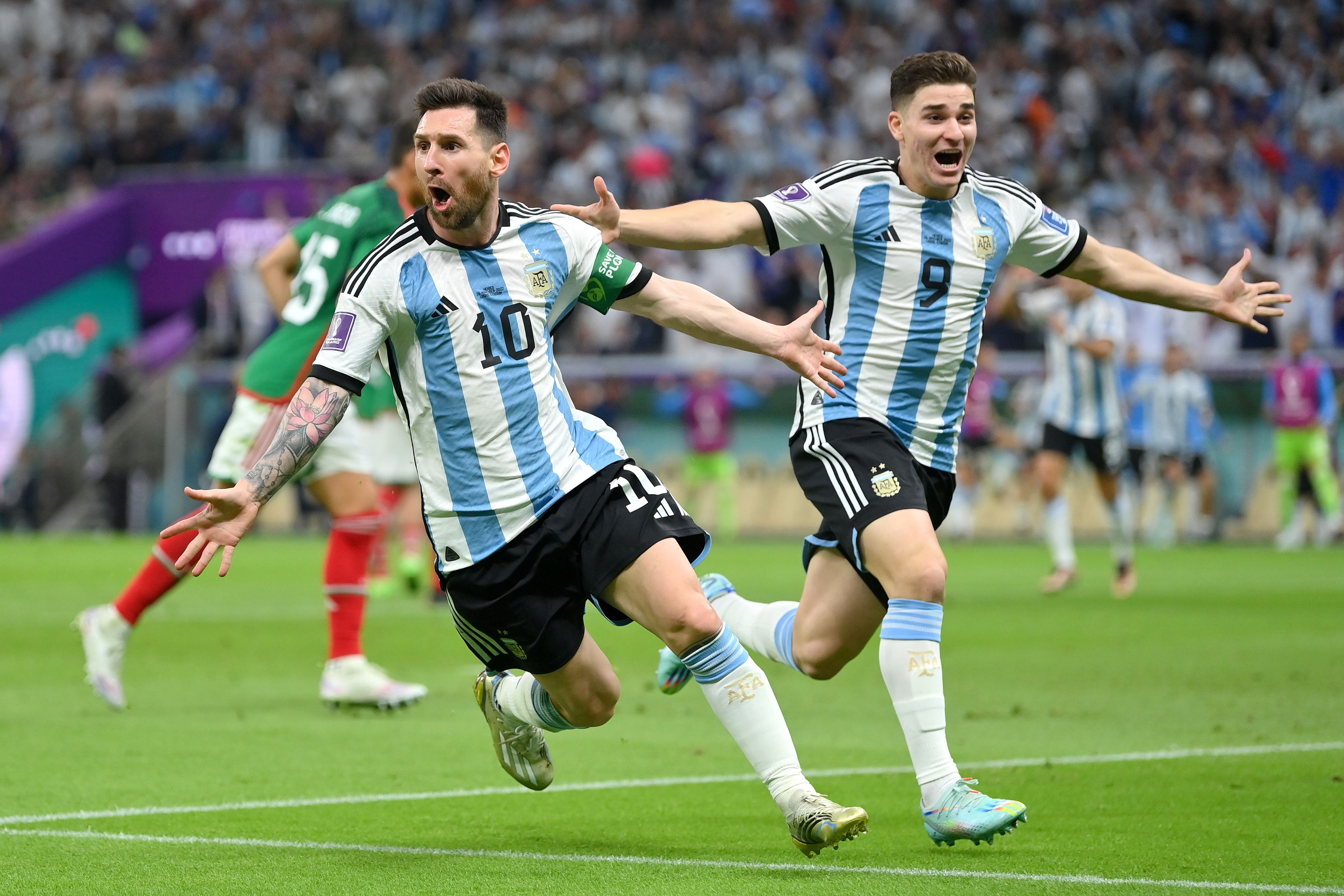 Lionel Messi and Julian Alvarez celebrate Argentina World Cup goal