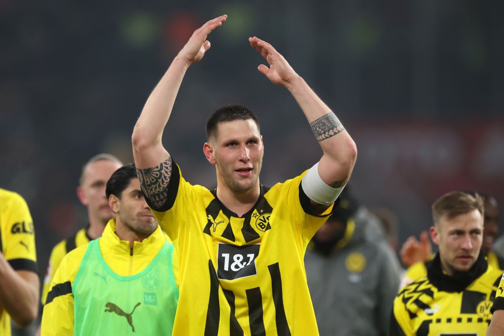 Borussia Dortmund's Niklas Sule interacts with the crowd