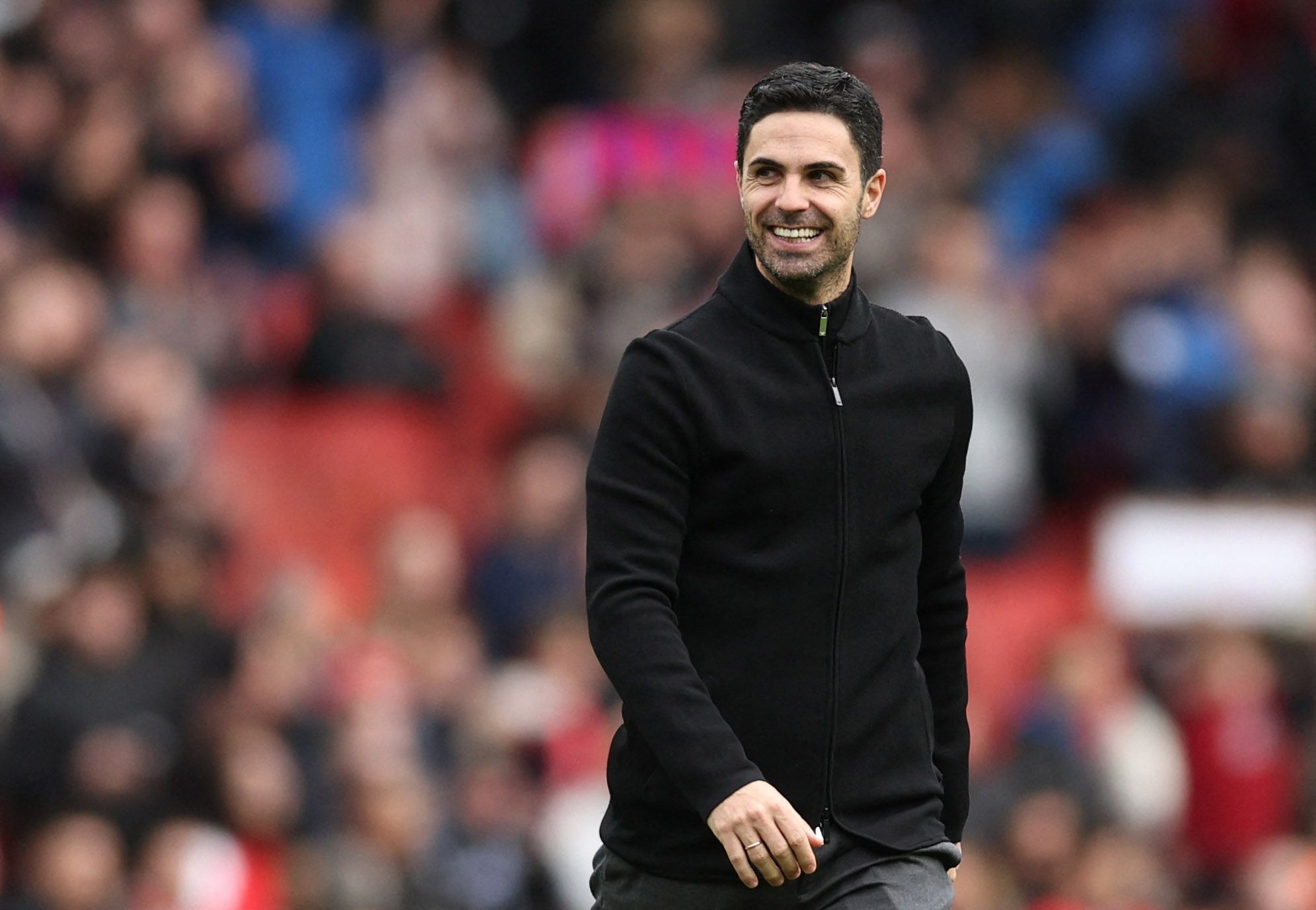 Arsenal manager Mikel Arteta smiling after victory
