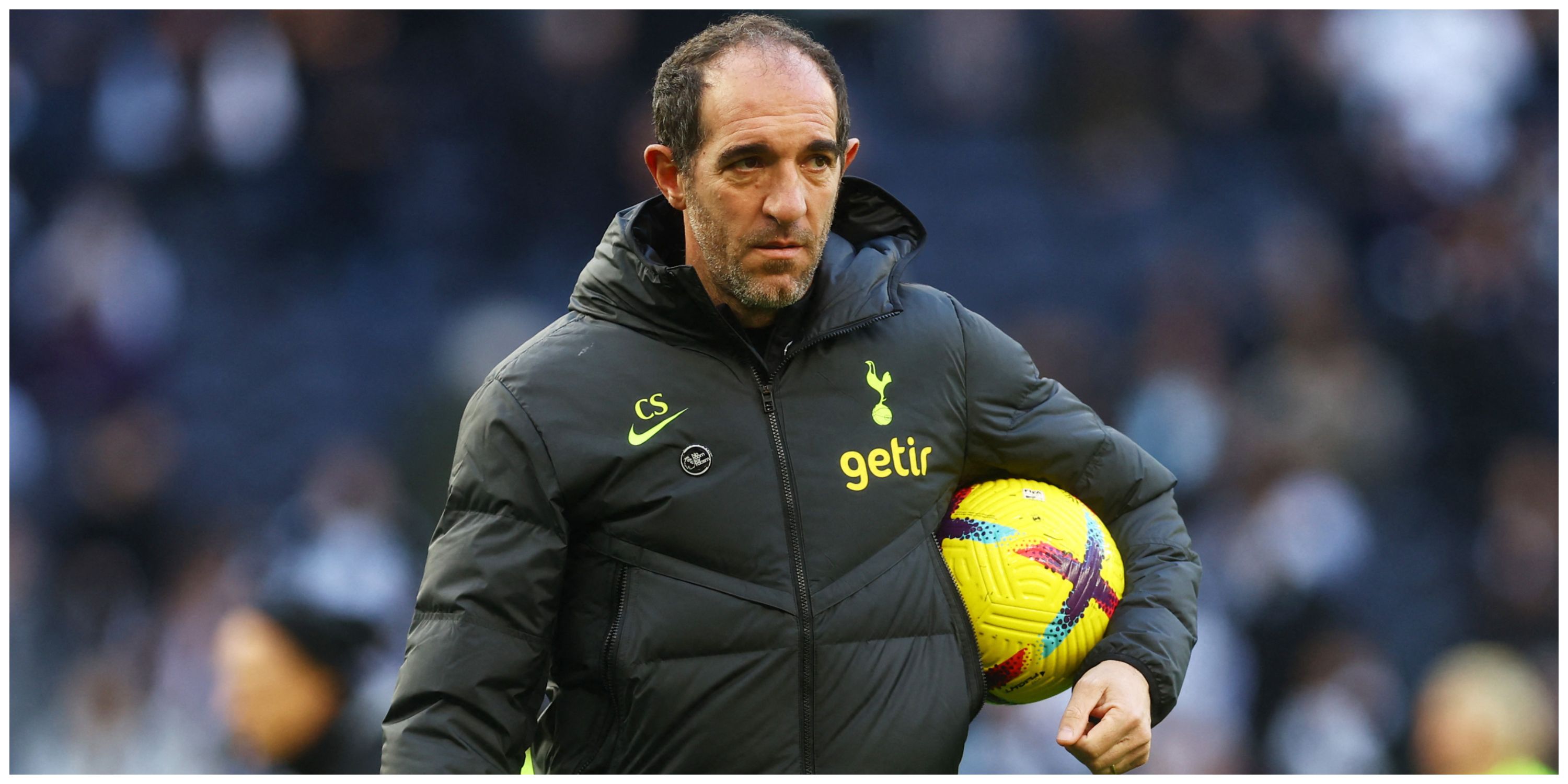 Tottenham interim manager Cristian Stellini holding ball