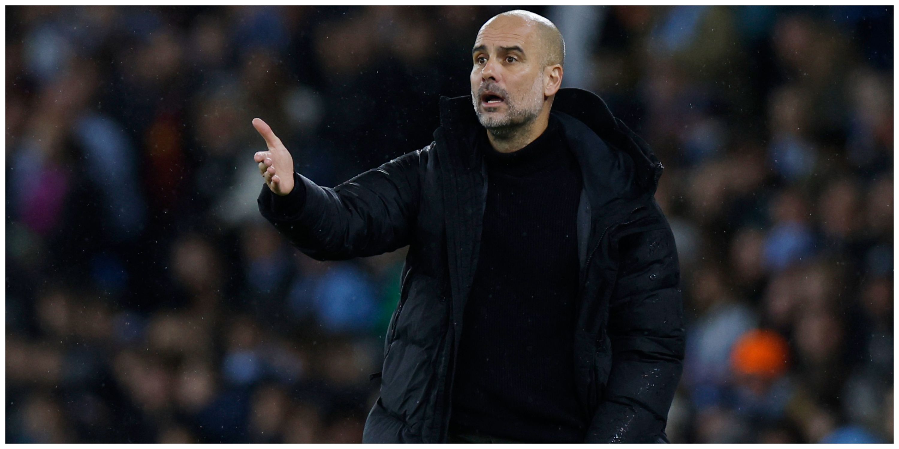 Manchester City manager Pep Guardiola with arm out