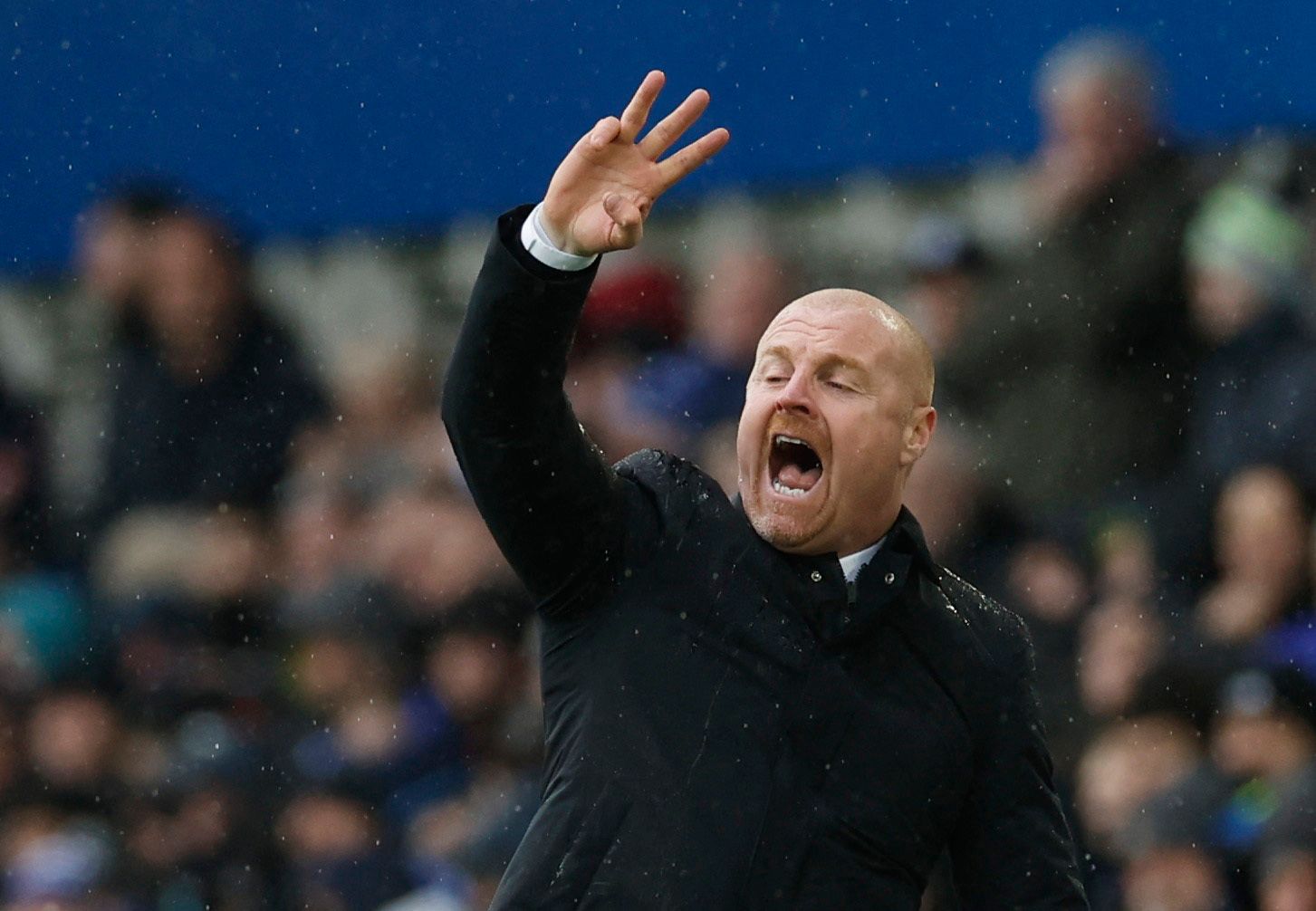 Everton manager Sean Dyche with his hand up in the air