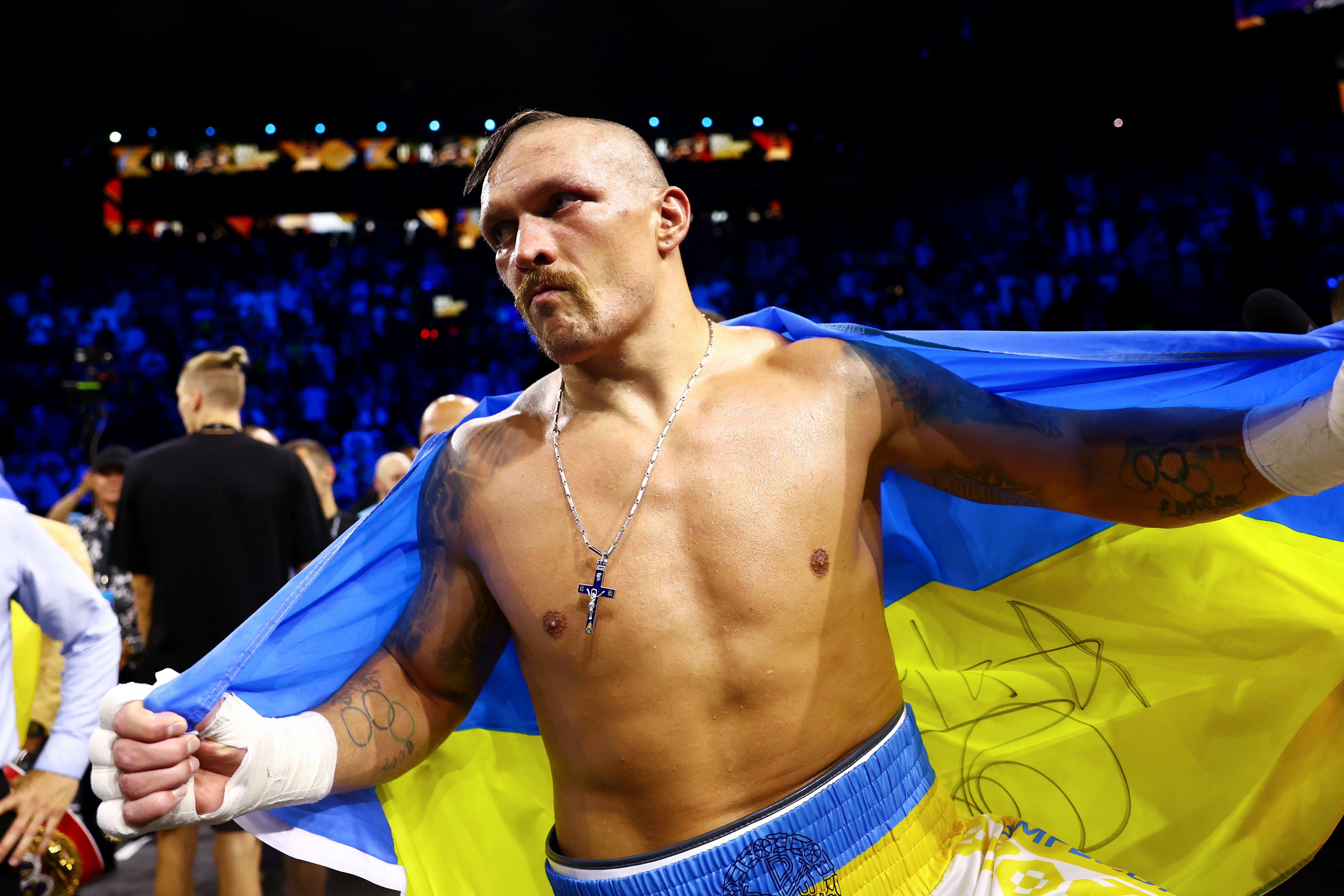 Oleksandr Usyk with a Ukraine flag