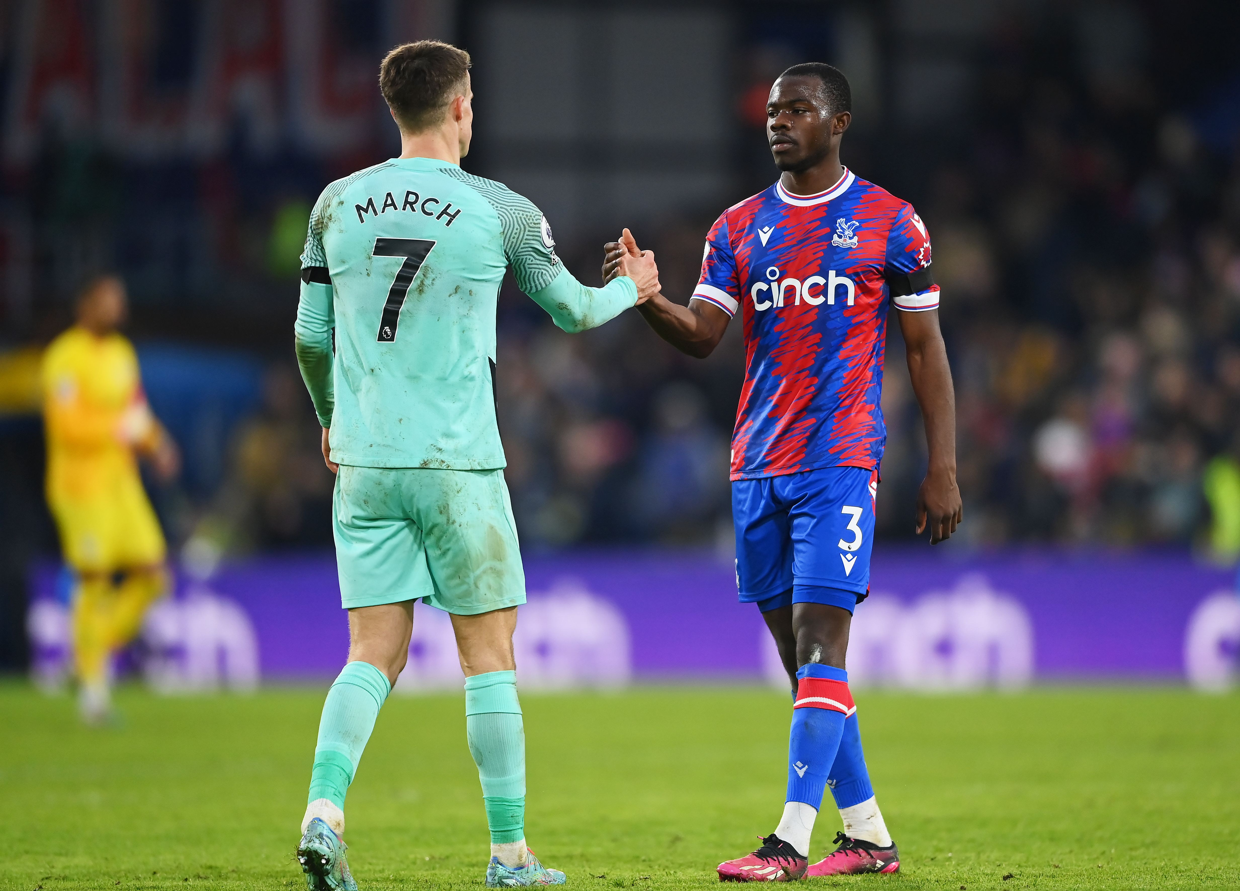 Solly March Brighton and Tyrick Mitchell Crystal Palace shake hands
