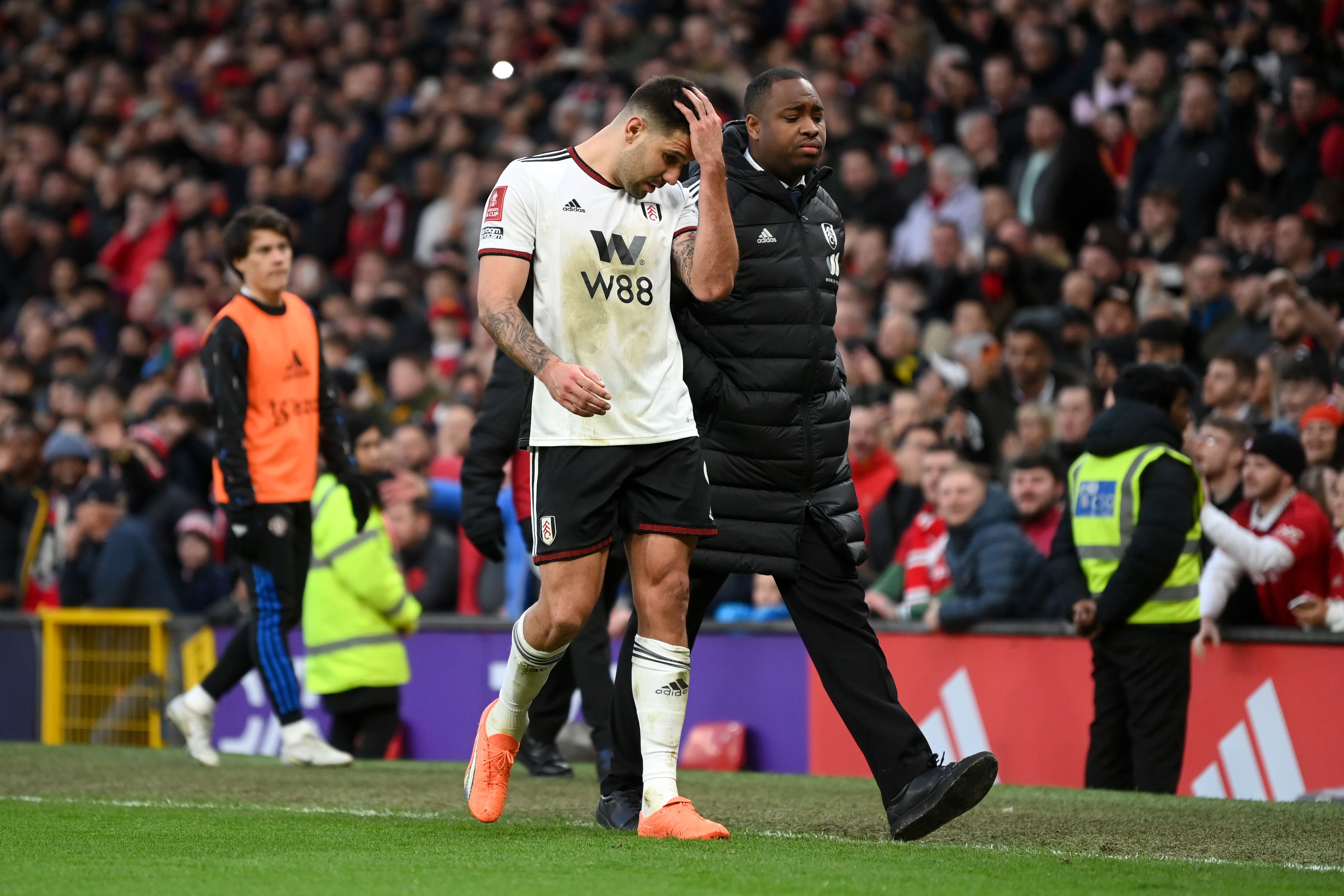Aleksandar Mitrovic of Fulham leaves the pitch vs Manchester United.