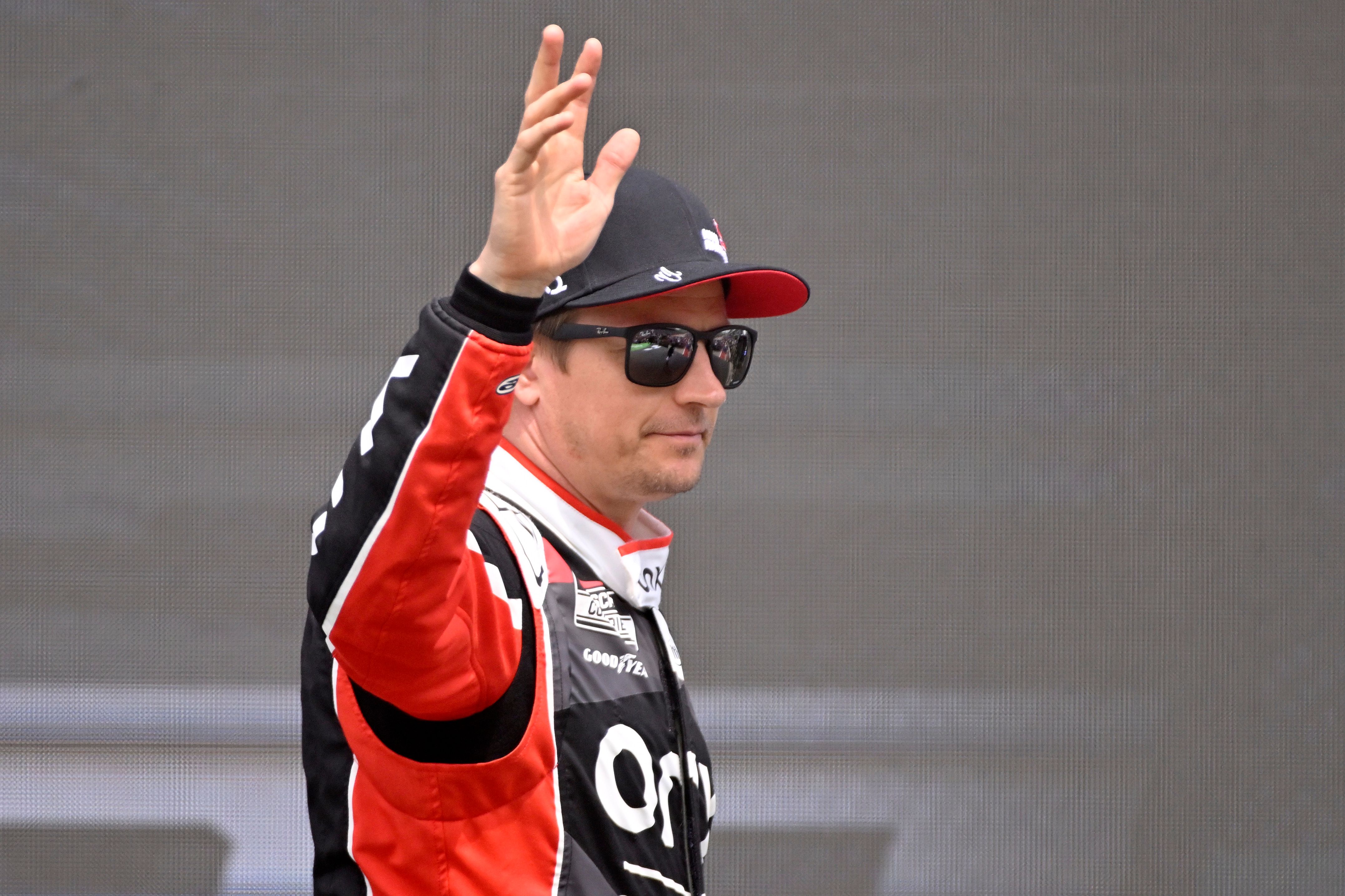 Kimi Raikkonen waves at the latest NASCAR round in Austin