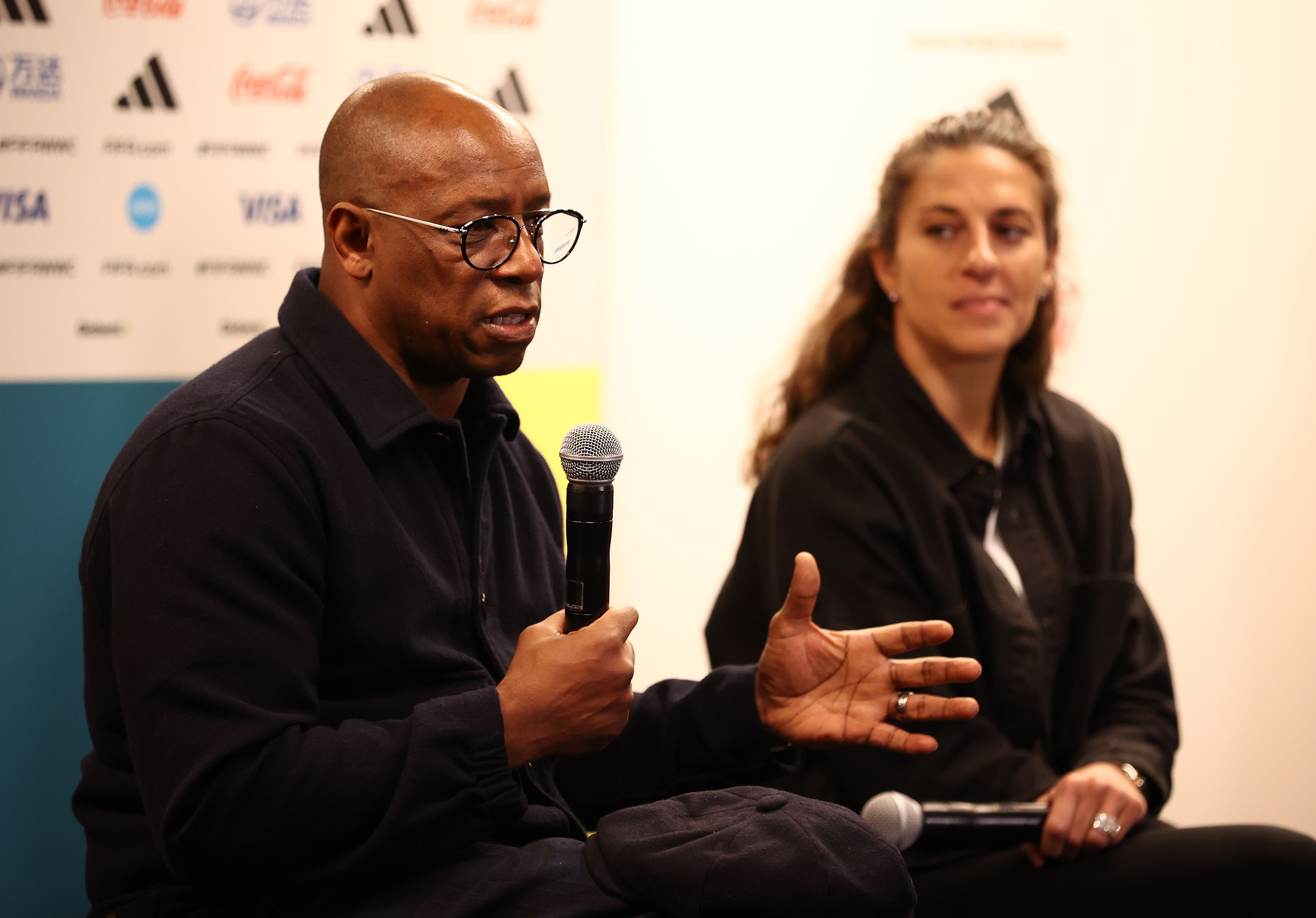 Ian Wright talks during a press conference