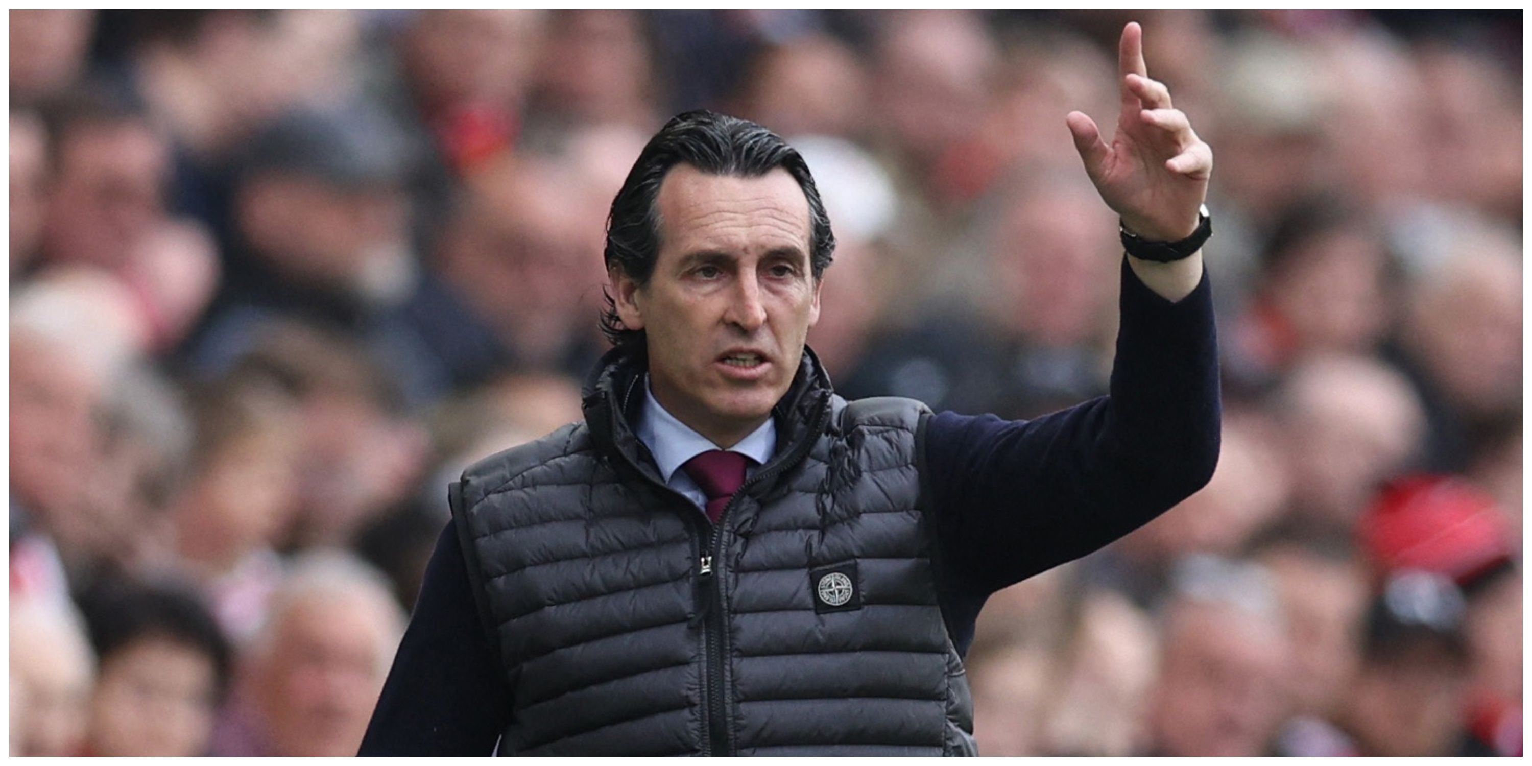 Aston Villa manager Unai Emery holding hand in air