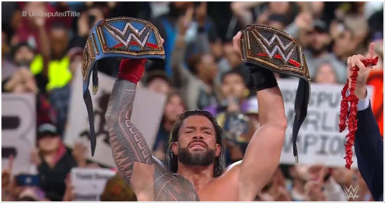 Roman Reigns with the Universal and WWE titles at WrestleMania 39.