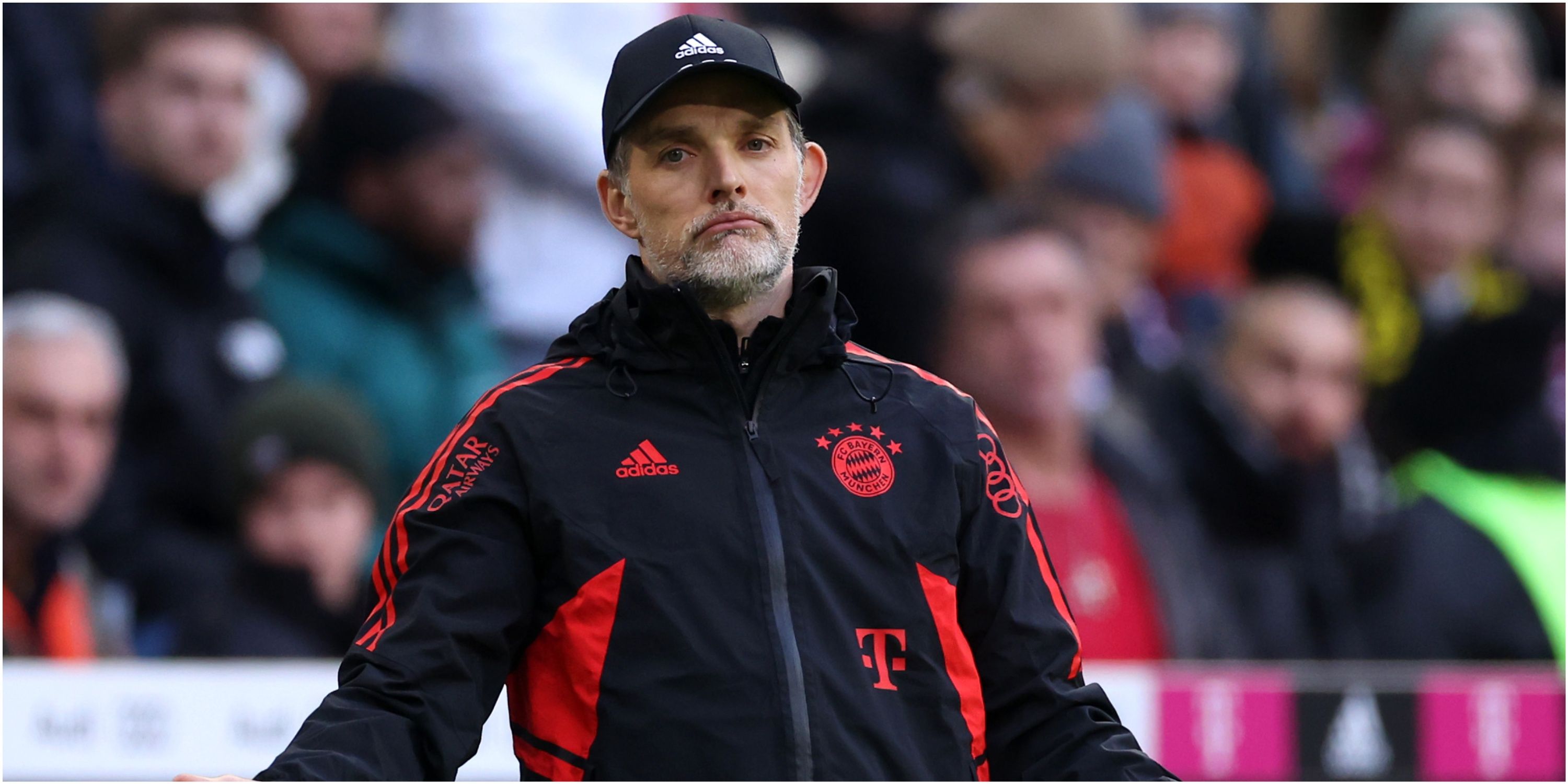  A photo of Bayern Munich's manager Thomas Tuchel looking concerned on the sidelines during a match, with the Bayern Munich logo in the background.