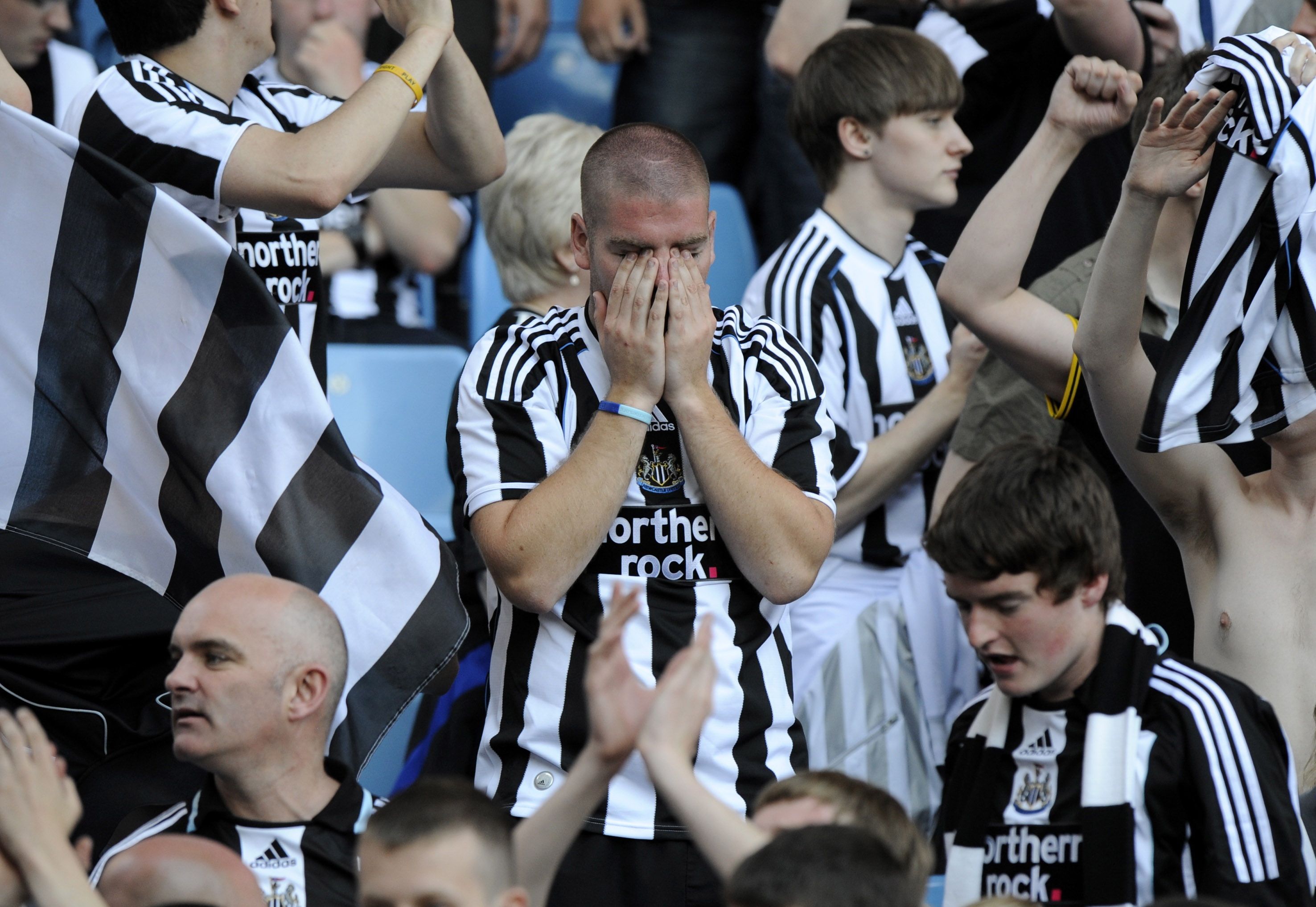 Newcastle United fan dejected after being relegated