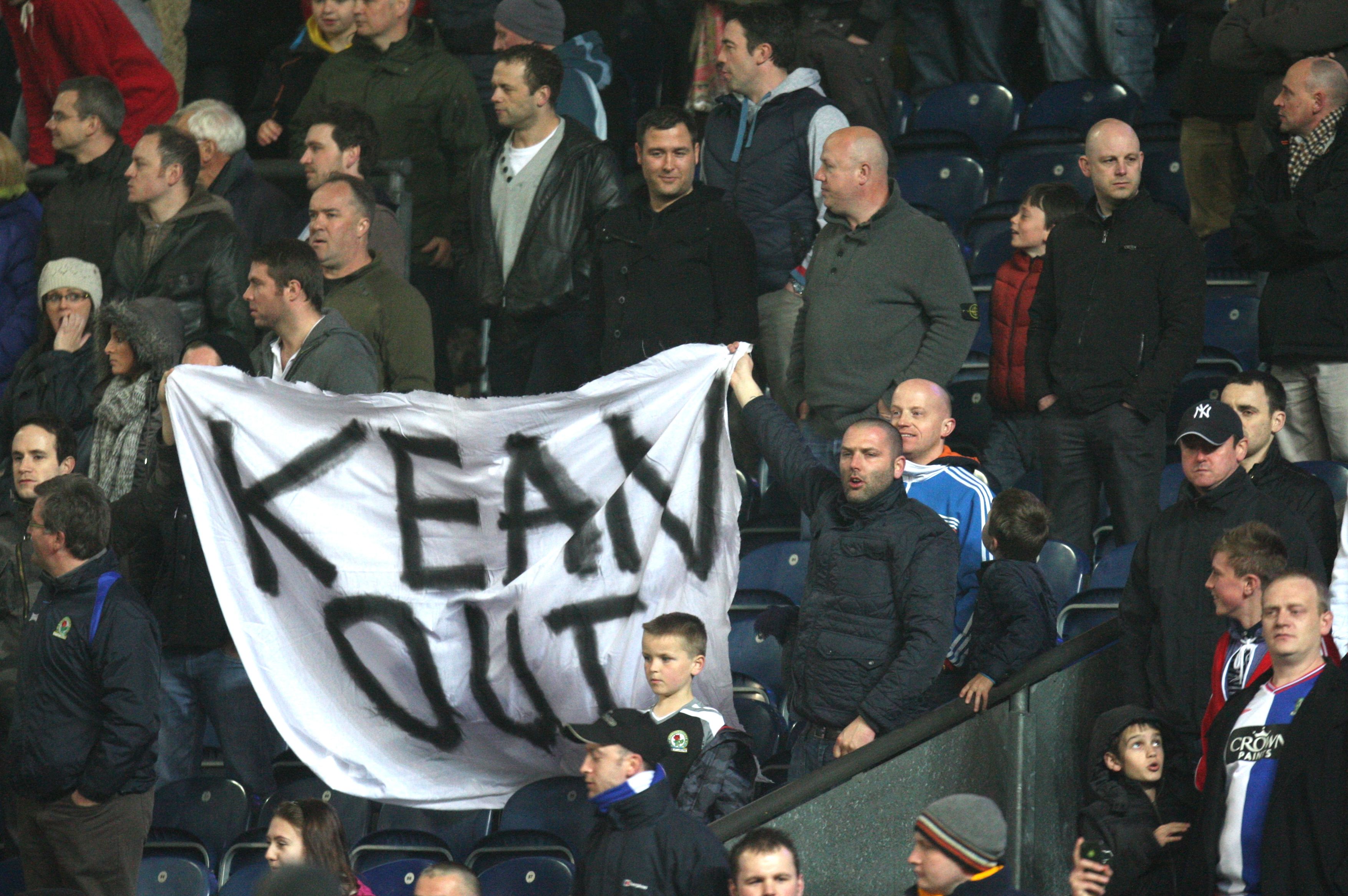 Blackburn fans holding a 'Kean Out' banner